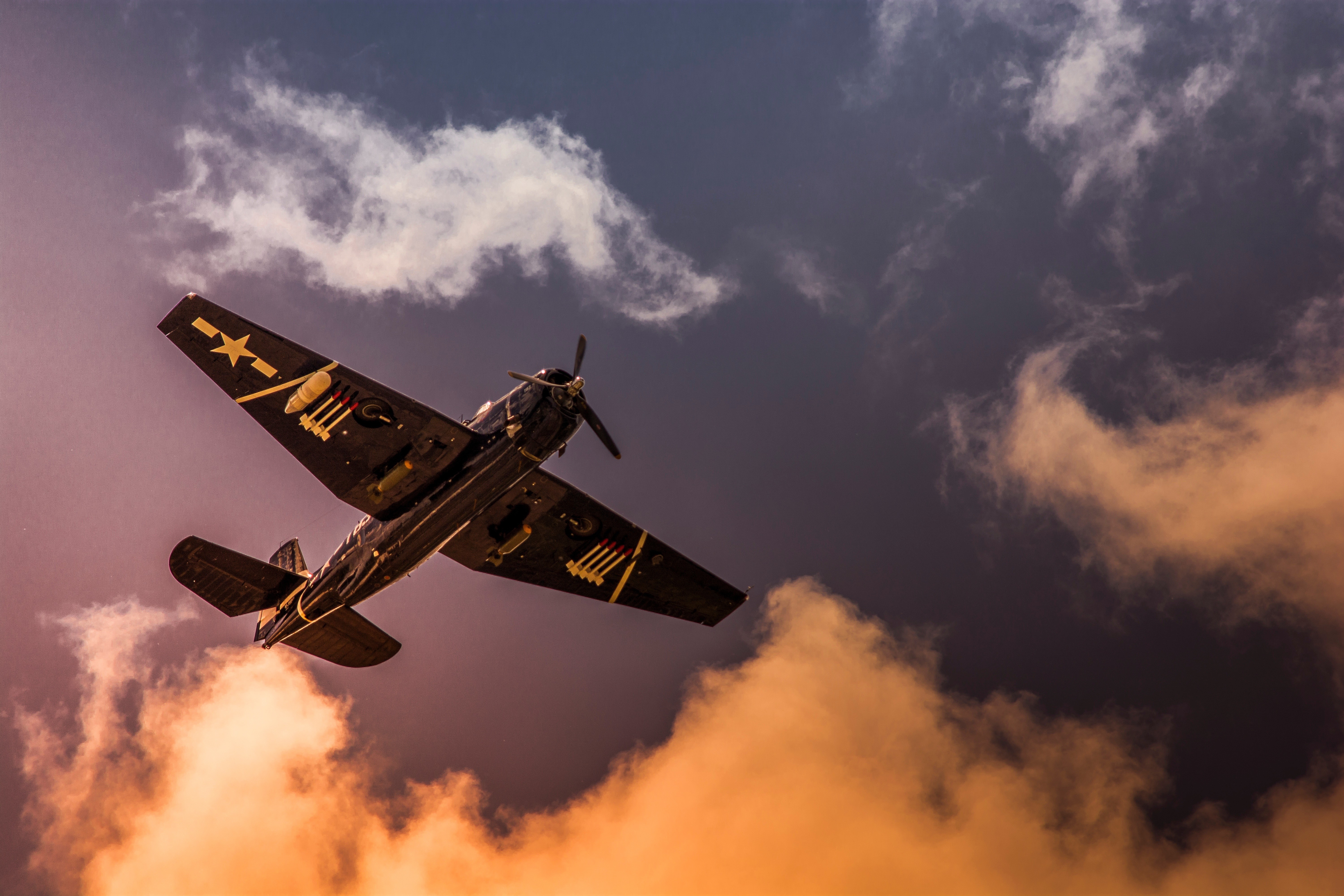 World War II airplane flying through clouds HD Wallpaper