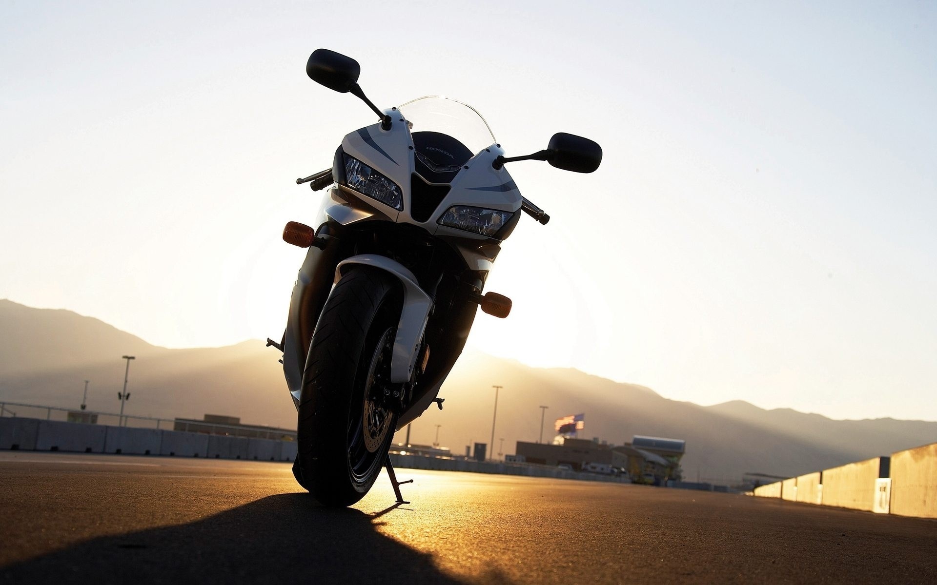 Honda CBR motorcycle at sunset on a race track HD Wallpaper
