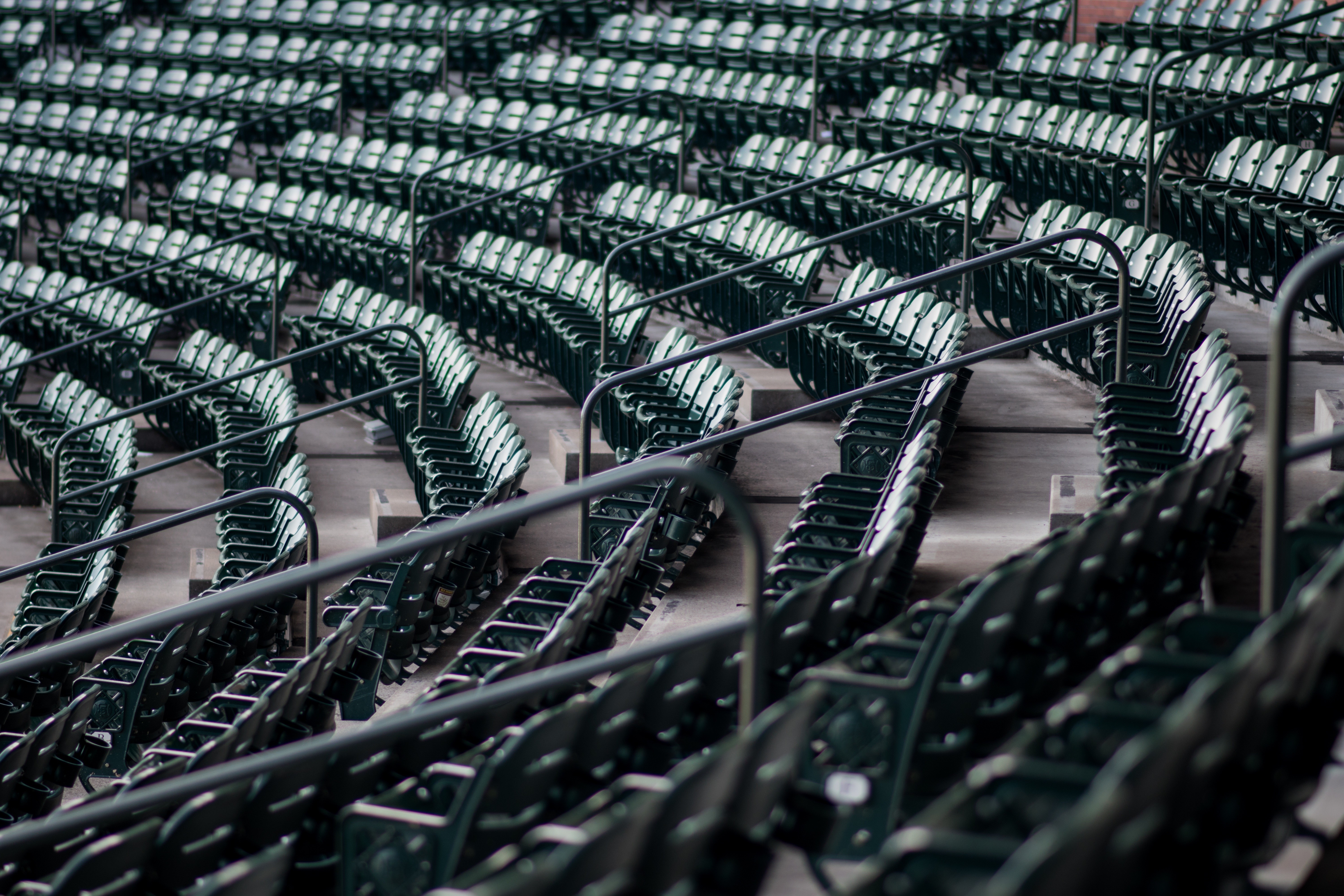 Empty stadium seats with railings HD Wallpaper