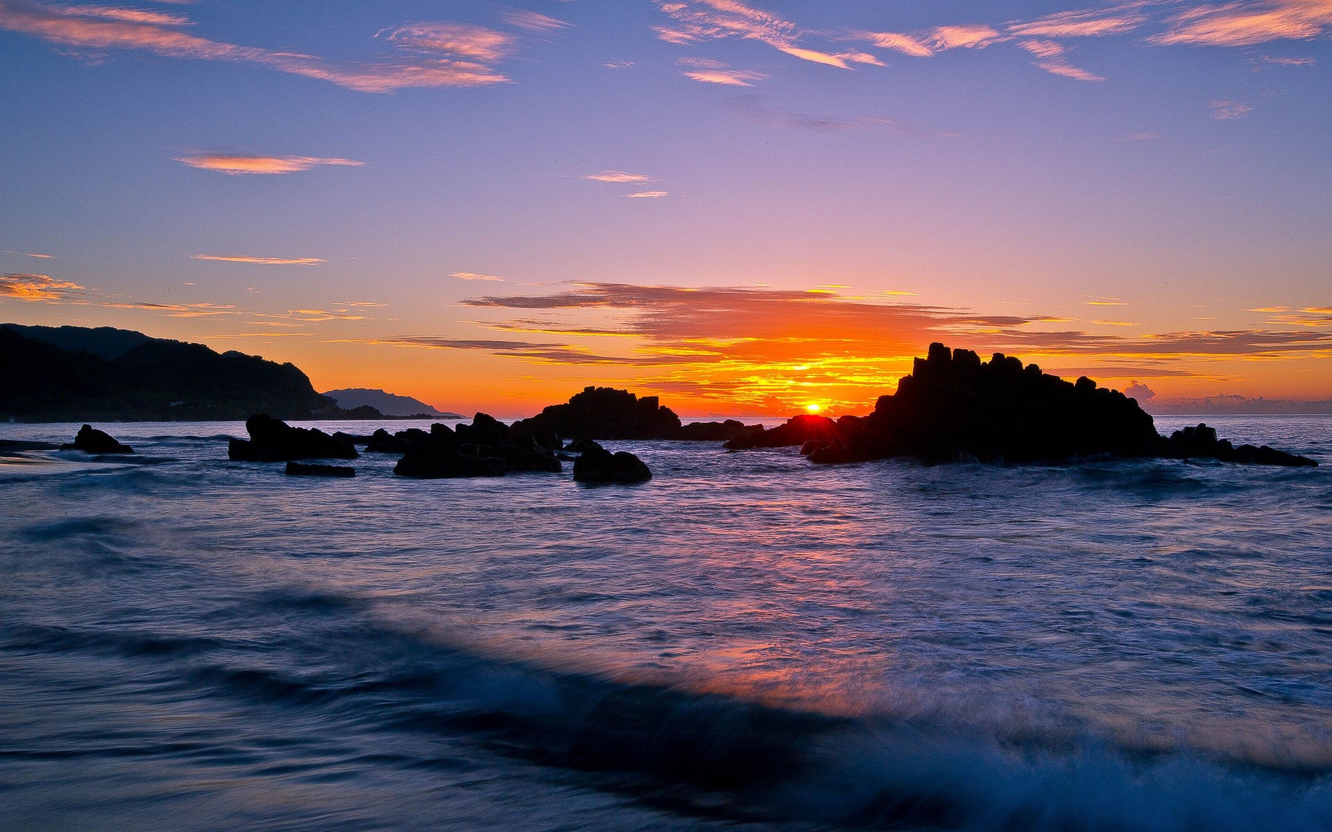 Sunset over the ocean with rocky shore HD Wallpaper