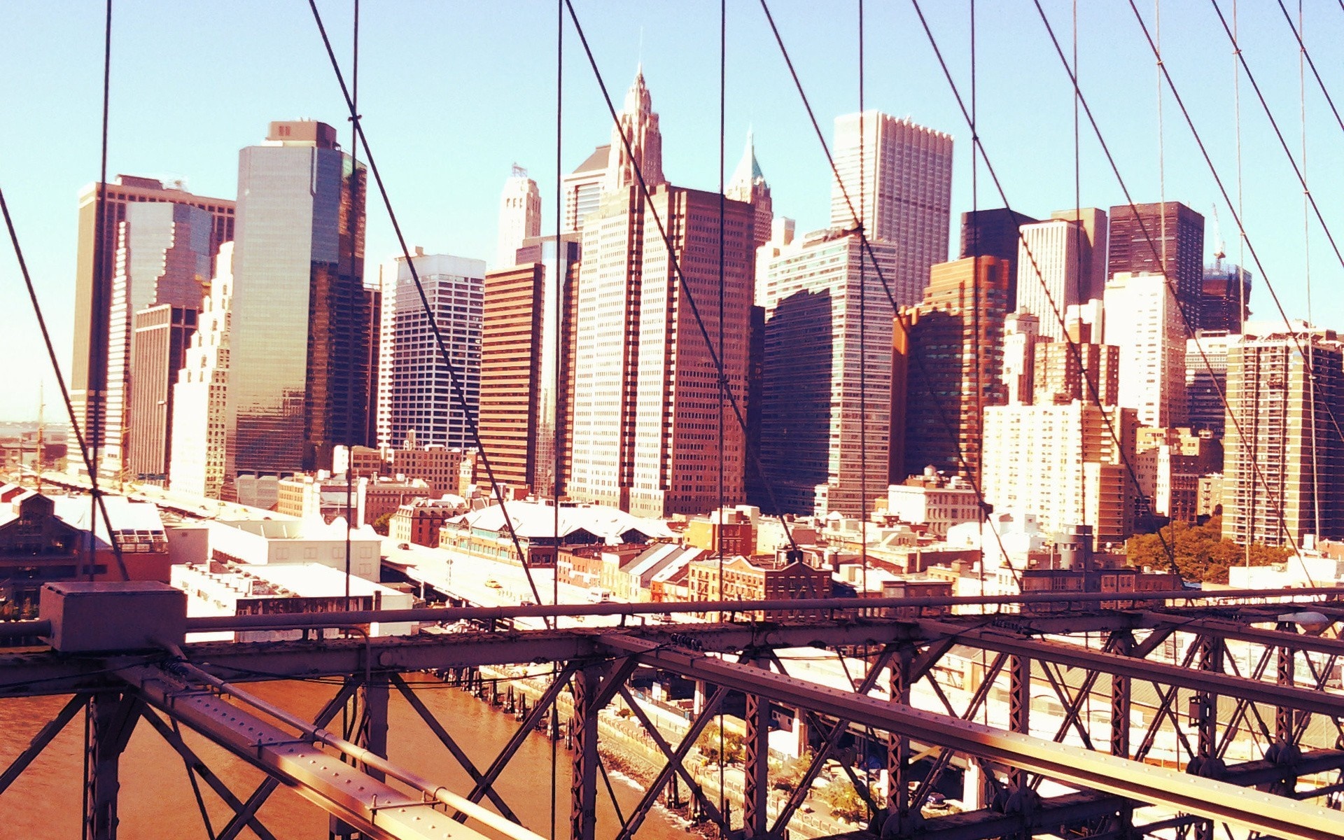 New York City skyline viewed from a bridge HD Wallpaper