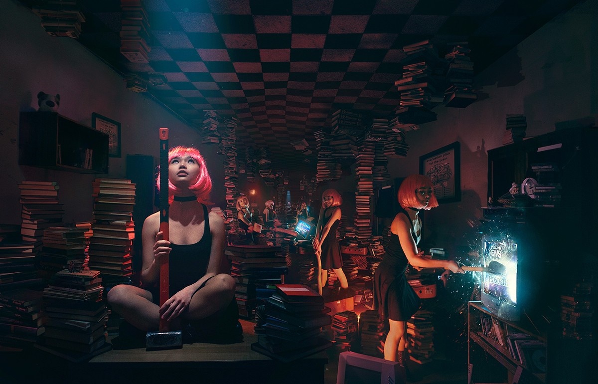Women with pink wigs in a surreal library setting HD Wallpaper
