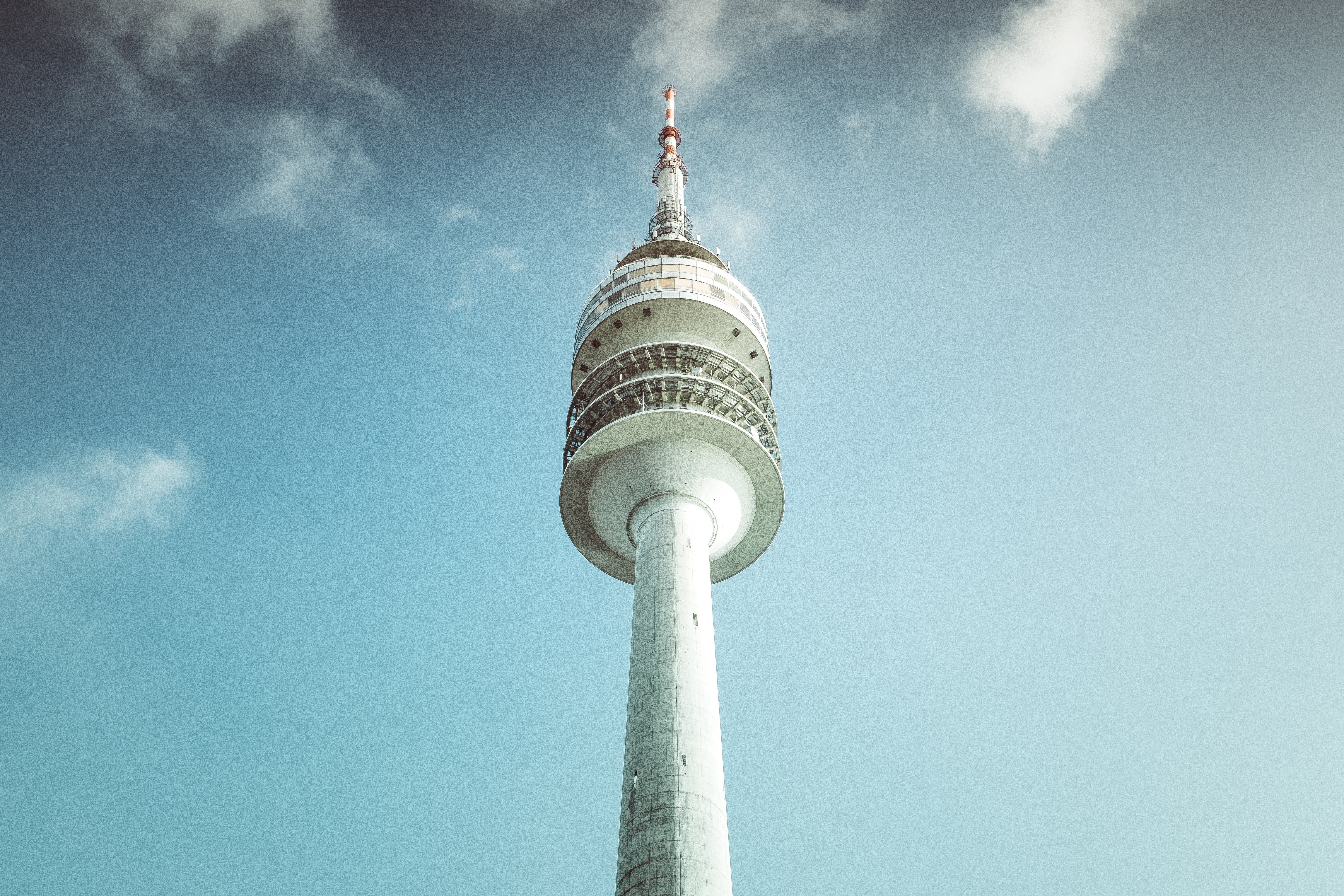 Television tower against a blue sky with clouds HD Wallpaper