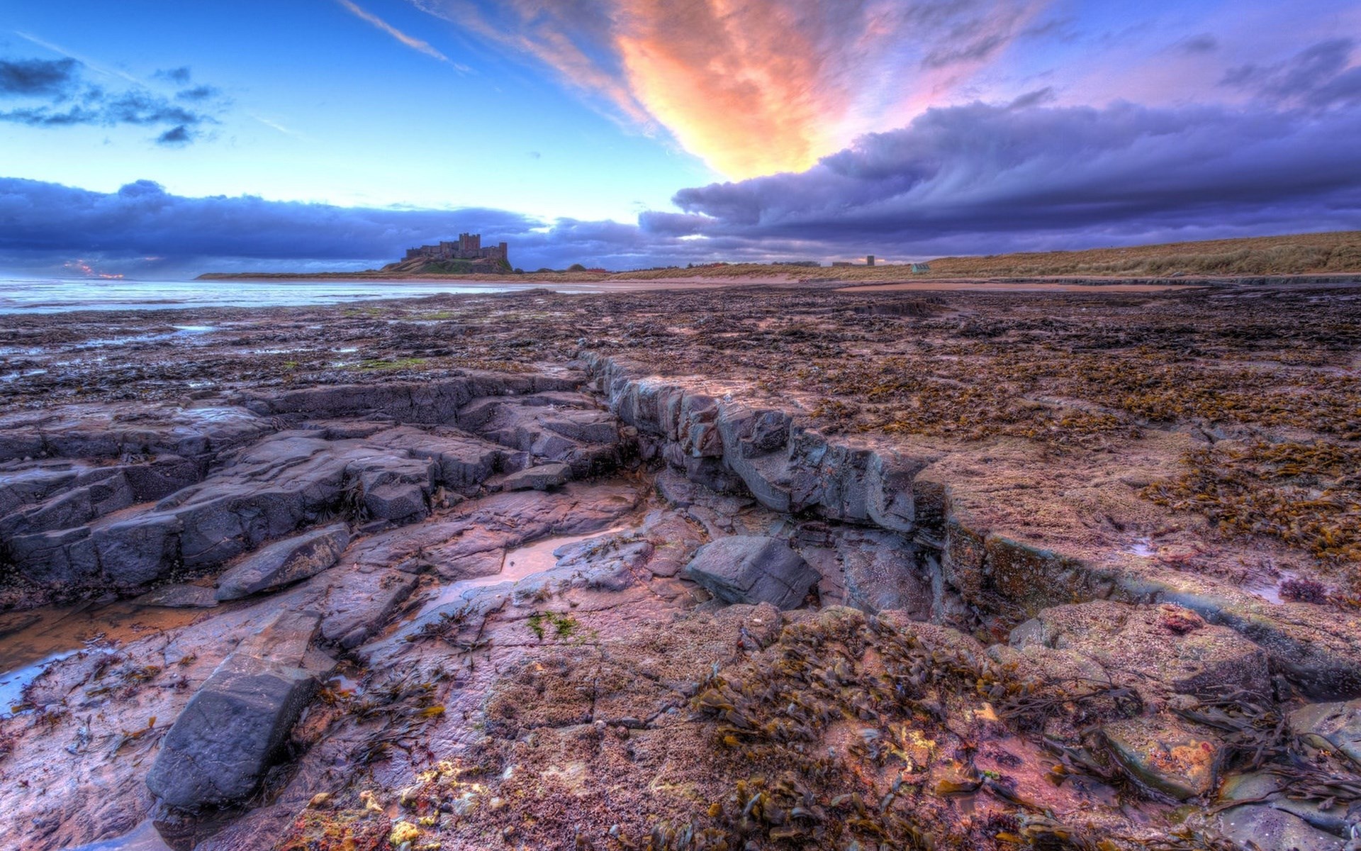 Bamburgh Castle on the coast at sunset HD Wallpaper