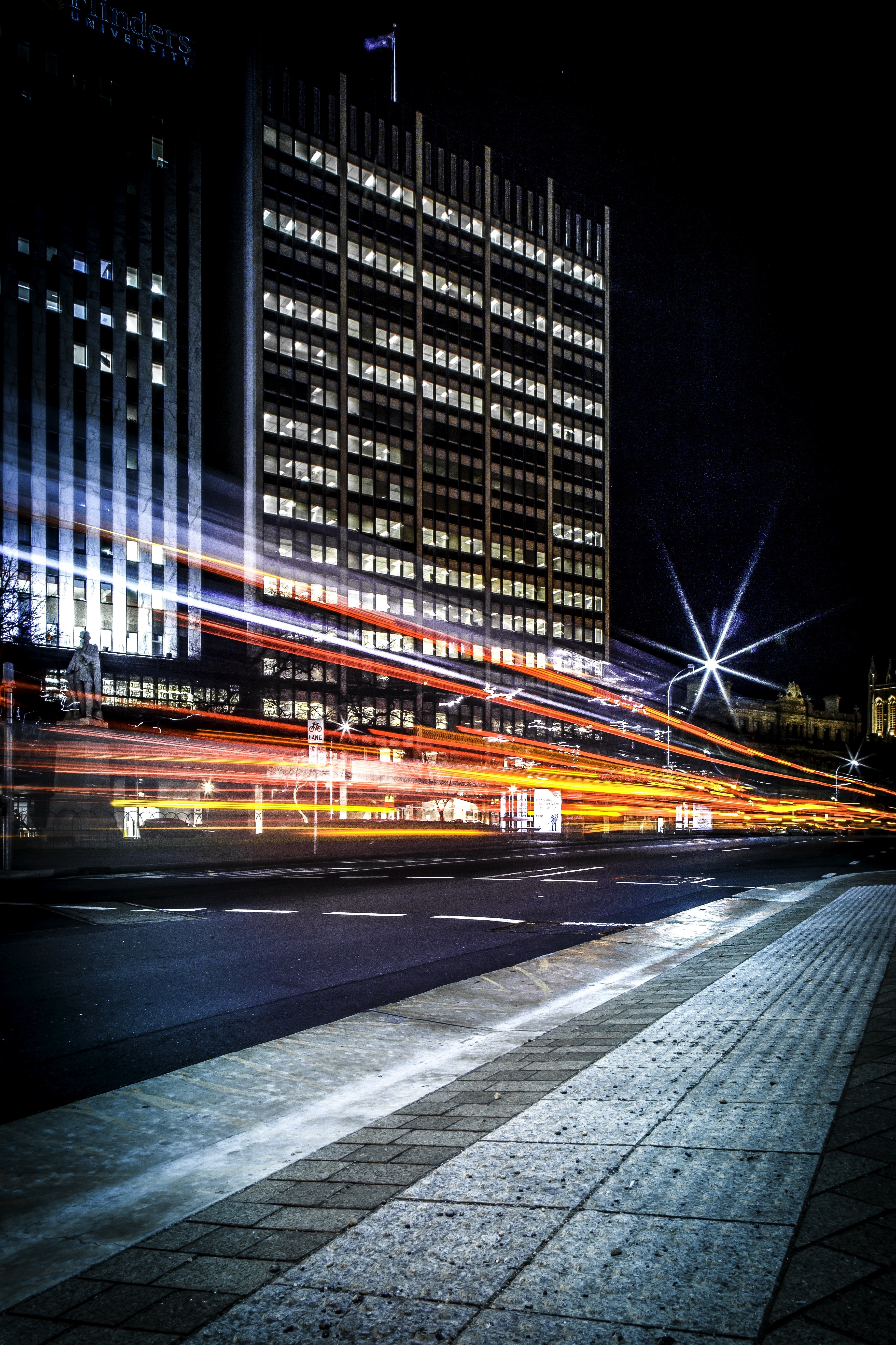 Flinders University building at night with light trails HD Wallpaper