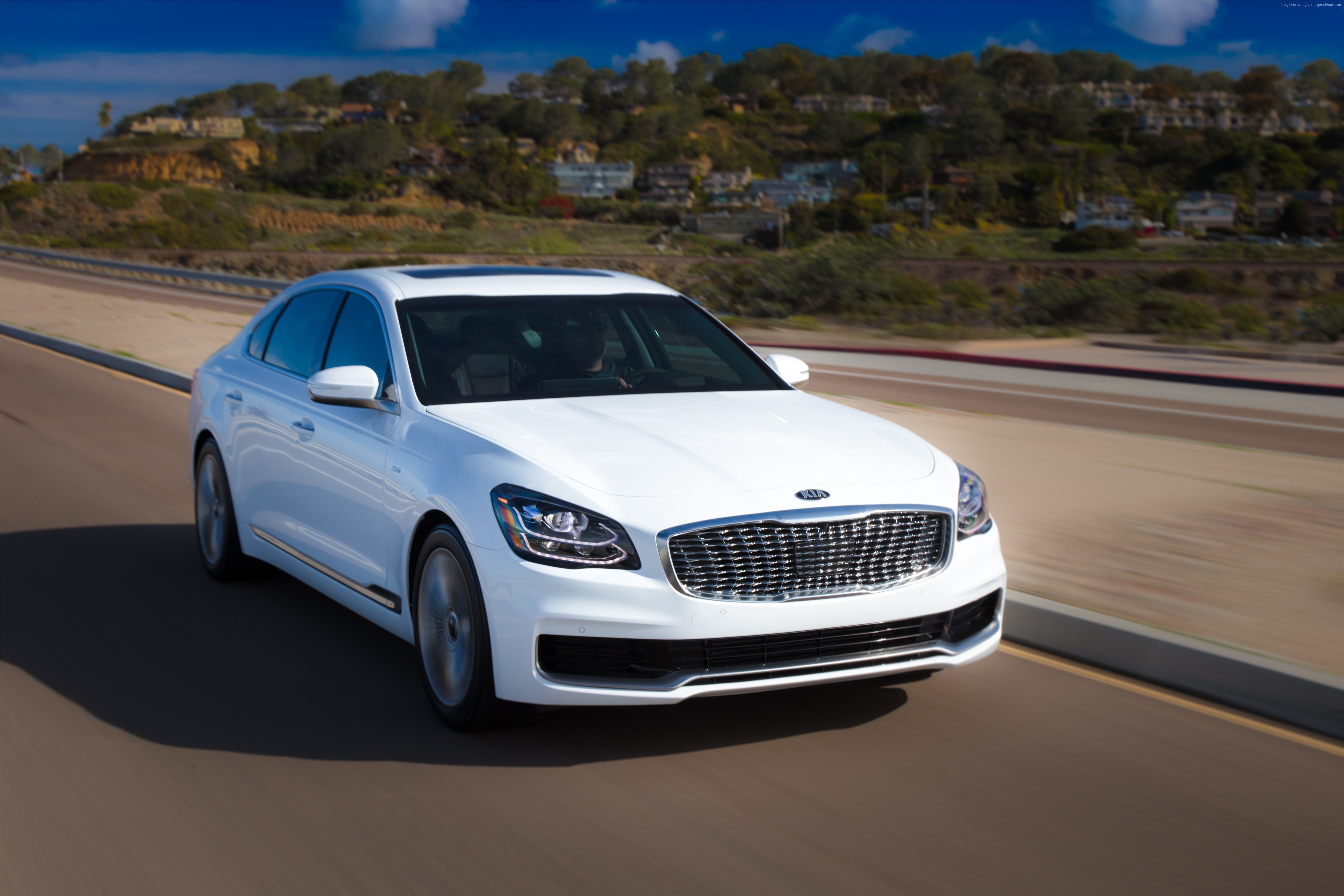 White 2019 Kia K900 driving on a road HD Wallpaper