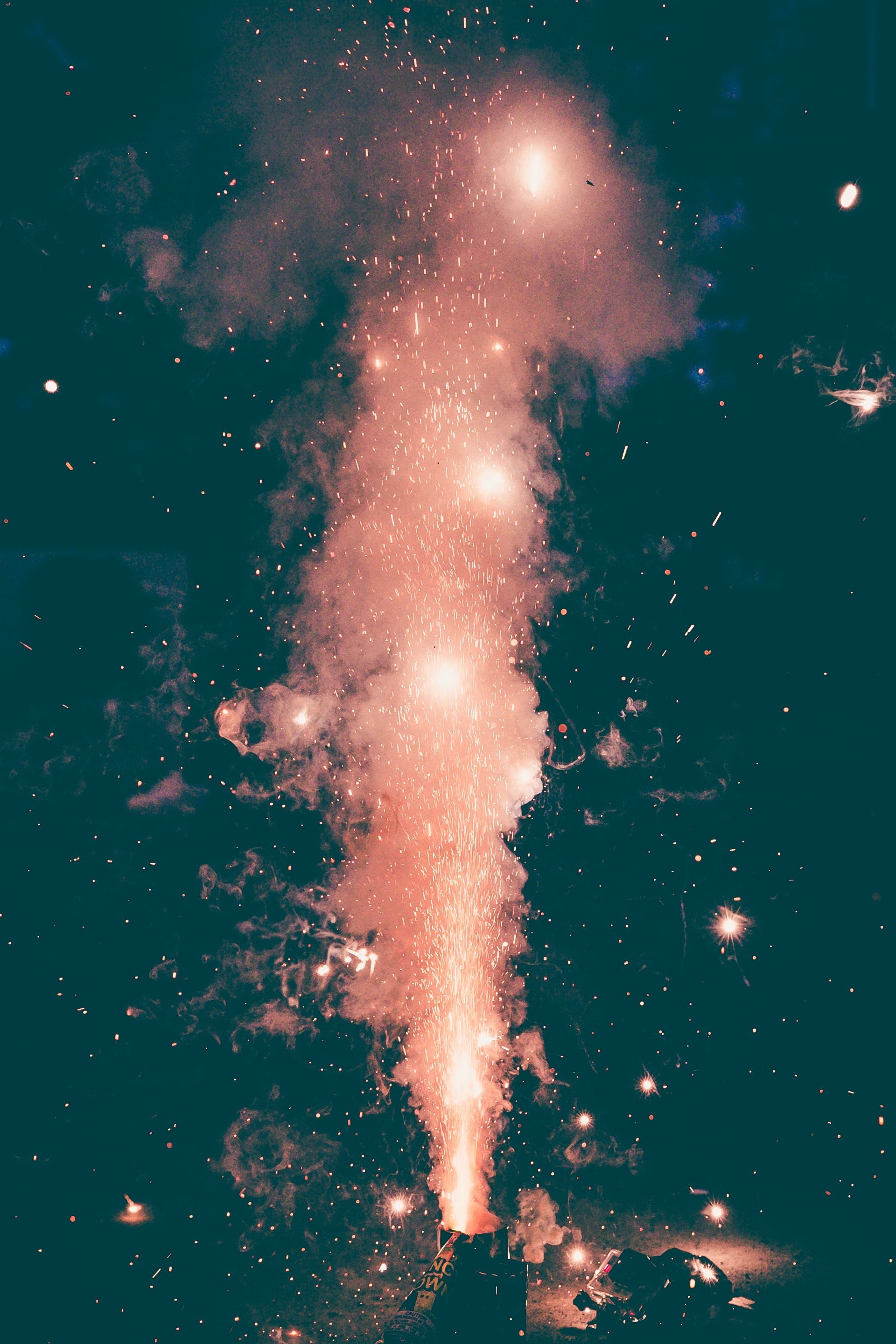 Fireworks exploding in the night sky HD Wallpaper