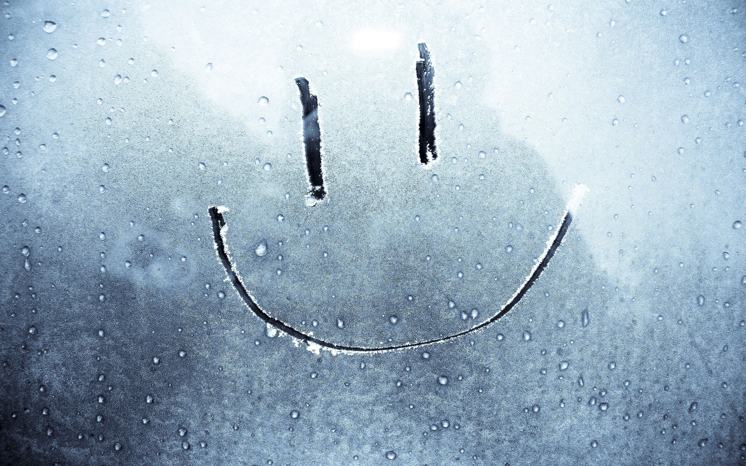 Smiley face drawn on a wet, frosted window HD Wallpaper