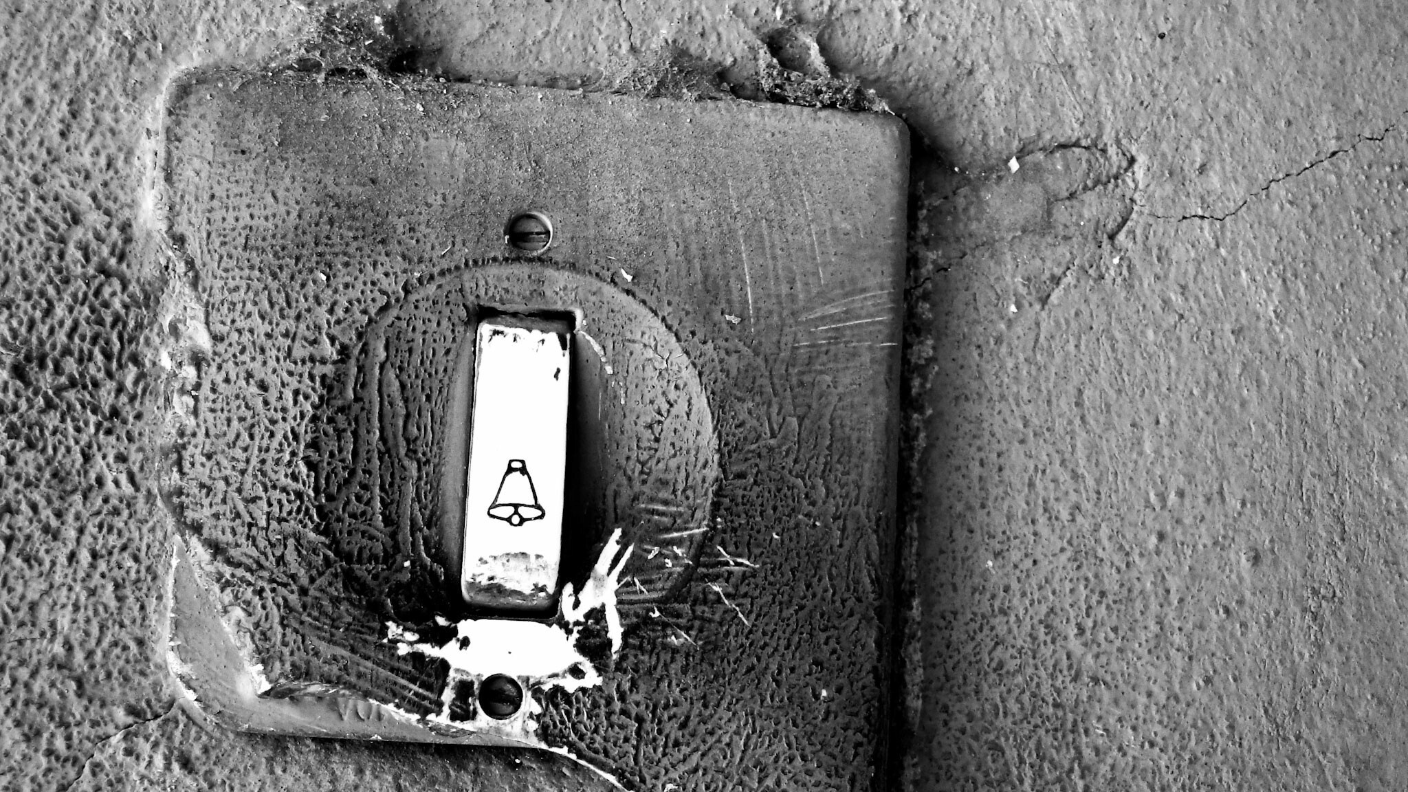 Close-up of an old doorbell with a bell symbol HD Wallpaper