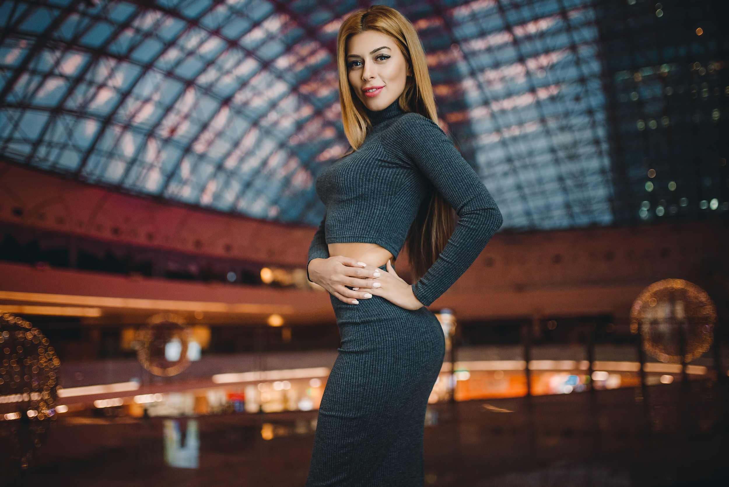 Woman in a grey turtleneck crop top and skirt HD Wallpaper