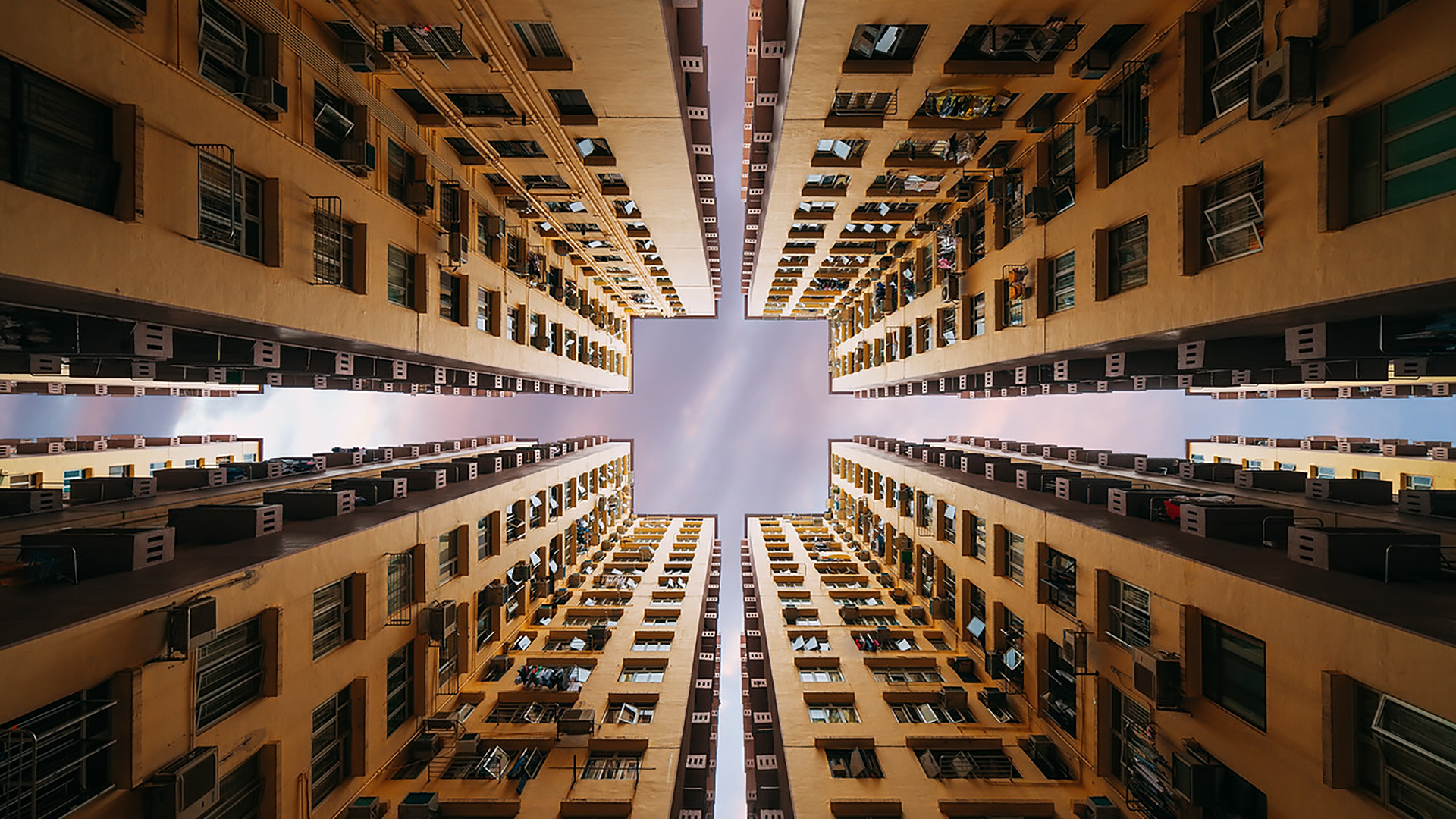 Apartment buildings viewed from below in Hong Kong HD Wallpaper