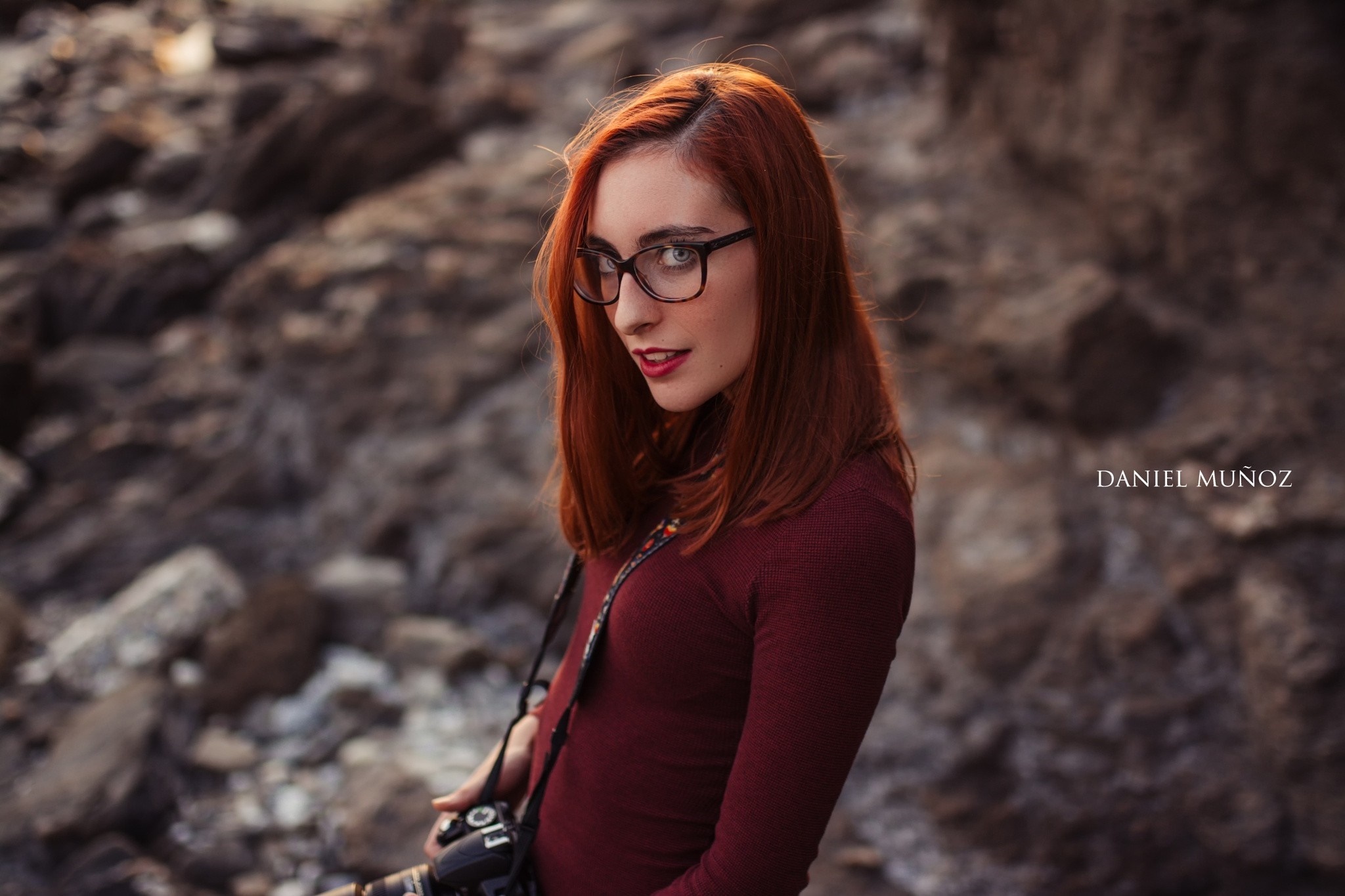 Woman with red hair and glasses holding a camera HD Wallpaper