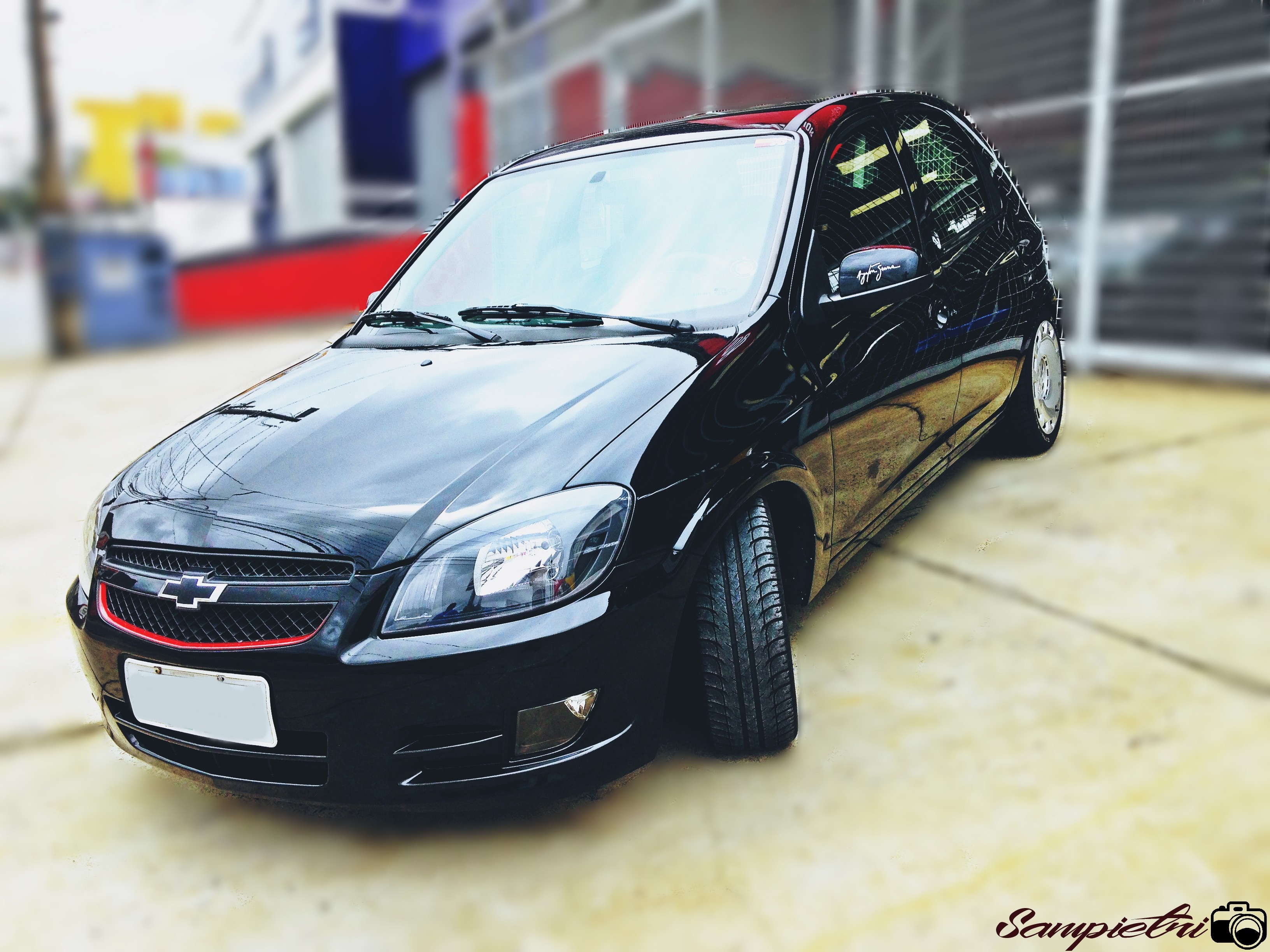 Black Chevrolet Celta parked outdoors HD Wallpaper