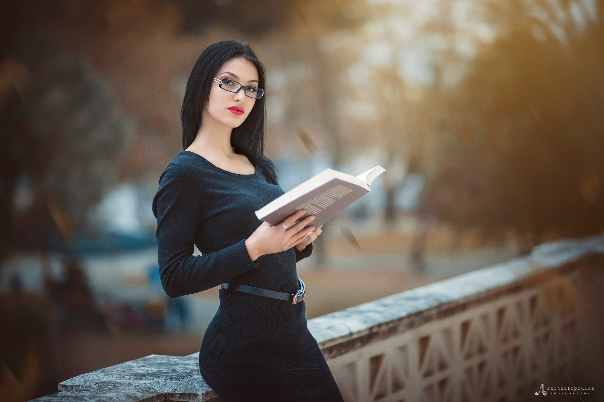 Elegant Woman in Black Dress Reading on Balcony HD Wallpaper