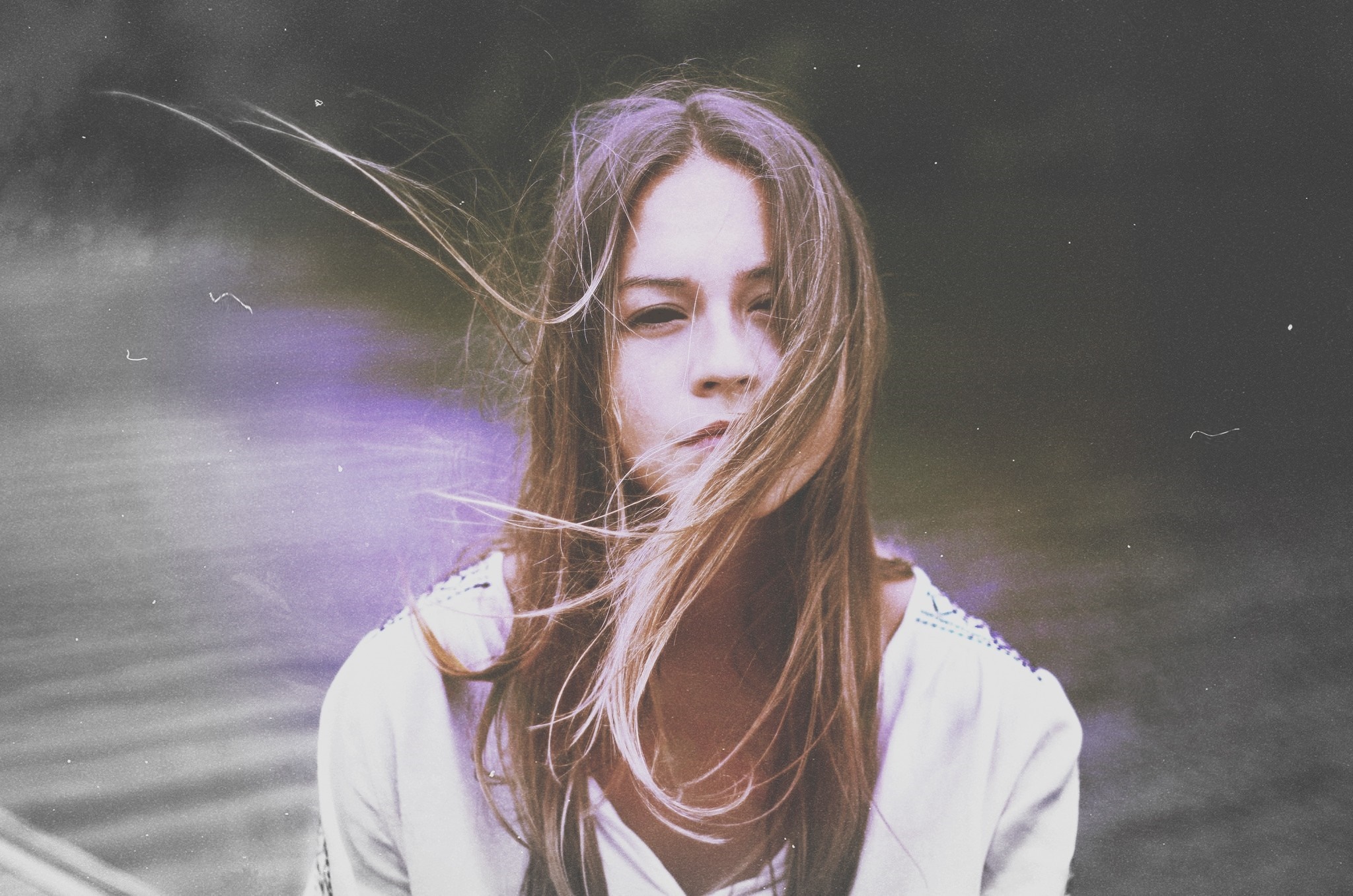 Woman with windblown hair in a white top HD Wallpaper