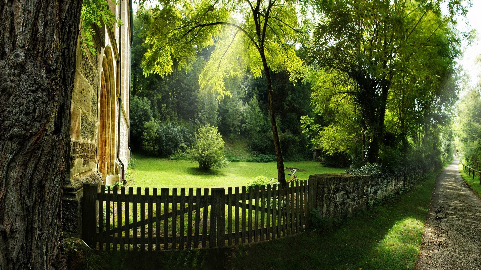 Old building with a wooden fence and a path HD Wallpaper