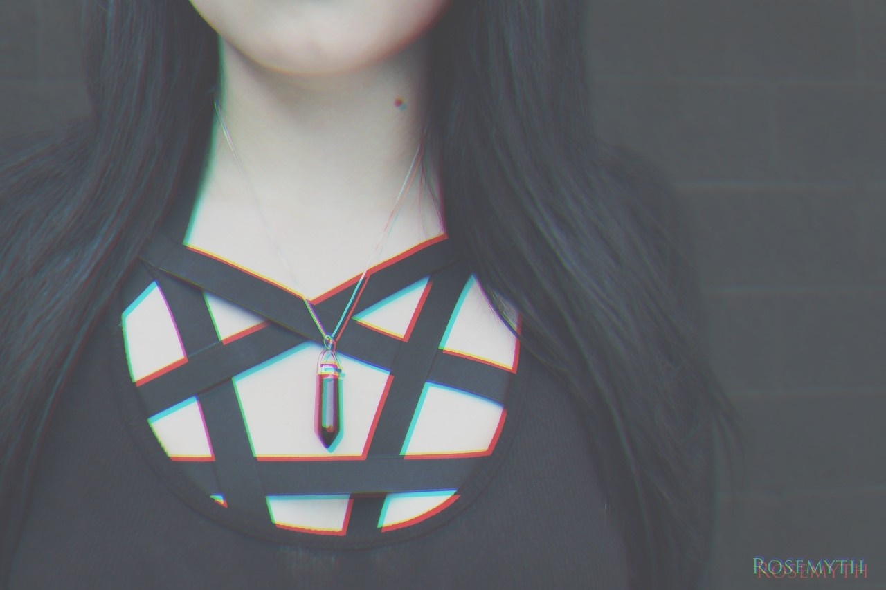 Woman wearing a black top with a pentagram design and a crystal pendant HD Wallpaper