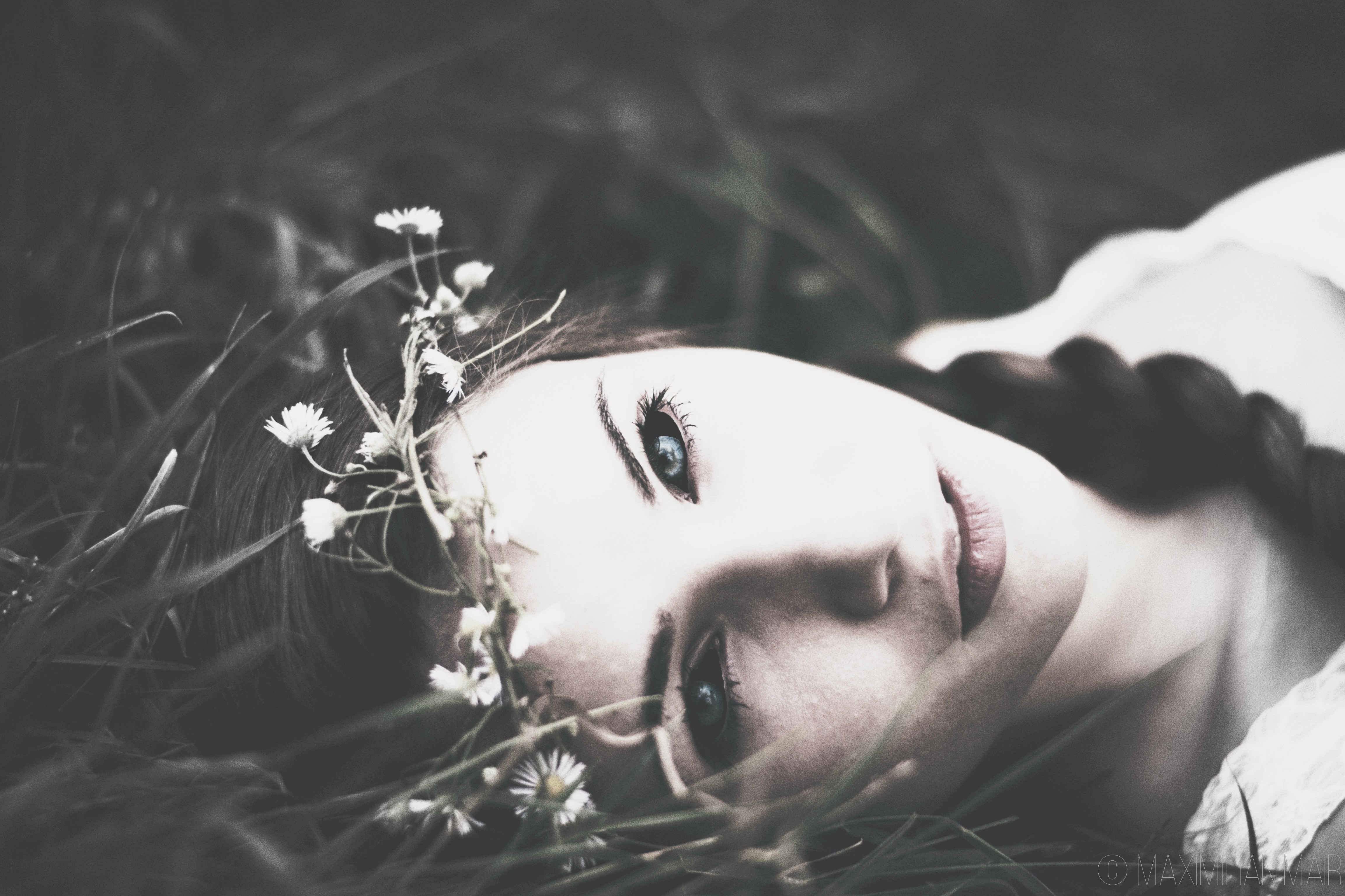 Woman with flower crown lying in grass HD Wallpaper