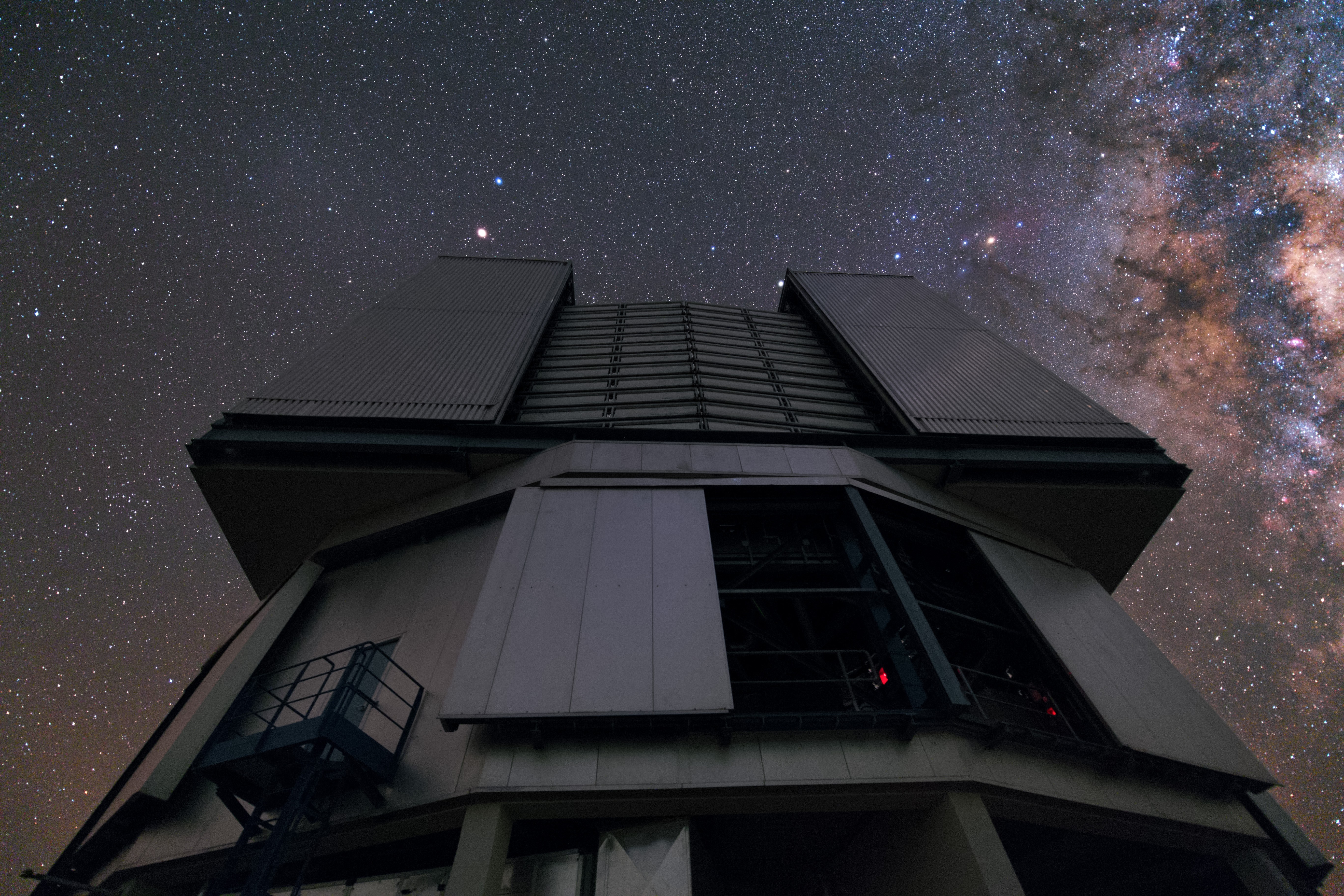 Observatory building under a starry night sky with the Milky Way HD Wallpaper