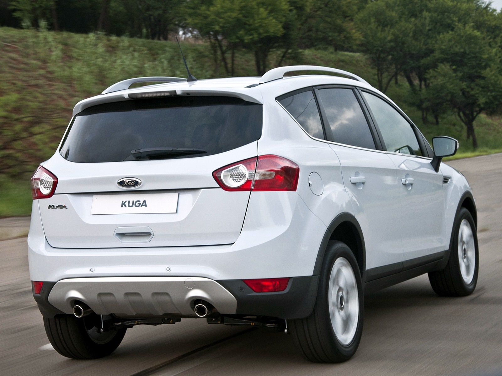 White Ford Kuga driving on a road HD Wallpaper