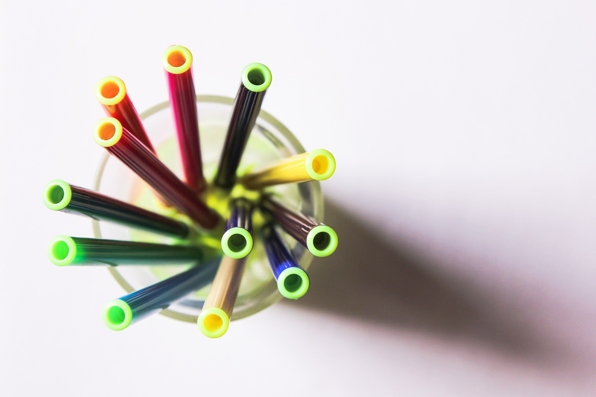 Top view of colorful pens in a glass HD Wallpaper