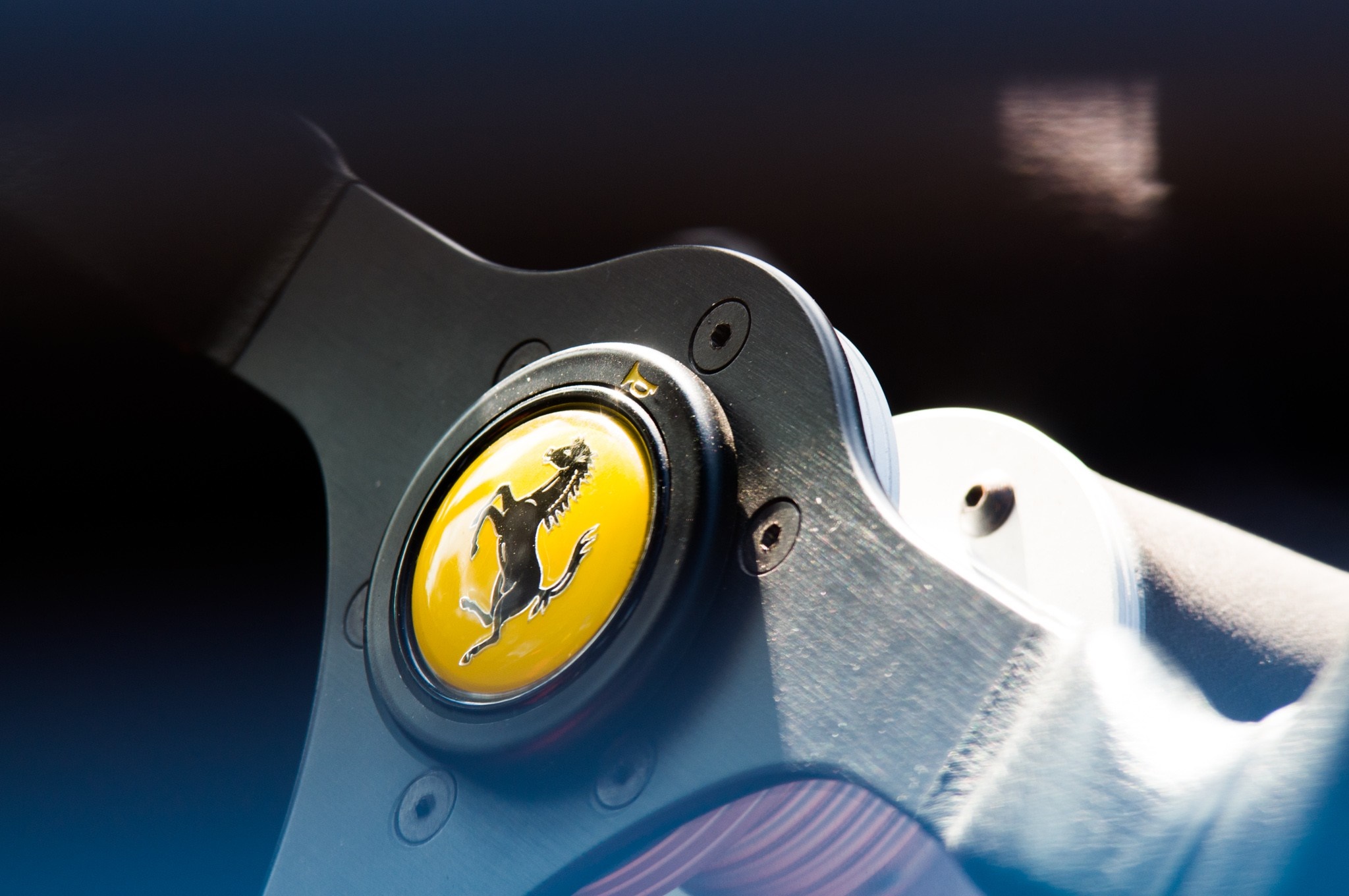 Ferrari steering wheel emblem macro photography HD Wallpaper