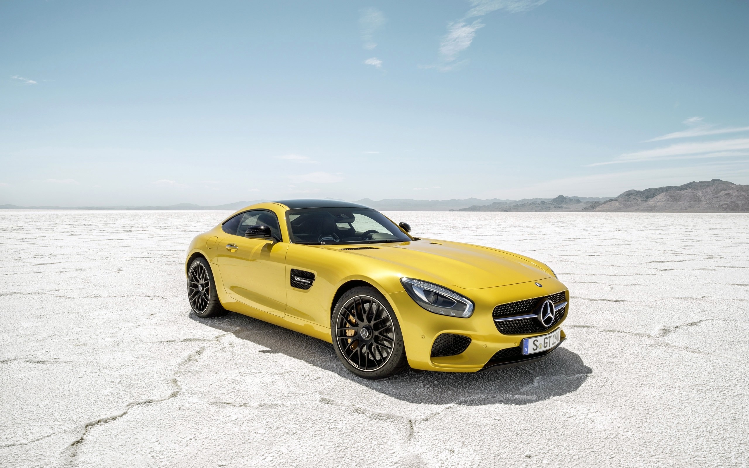 Yellow Mercedes-AMG GT S parked on a salt flat HD Wallpaper