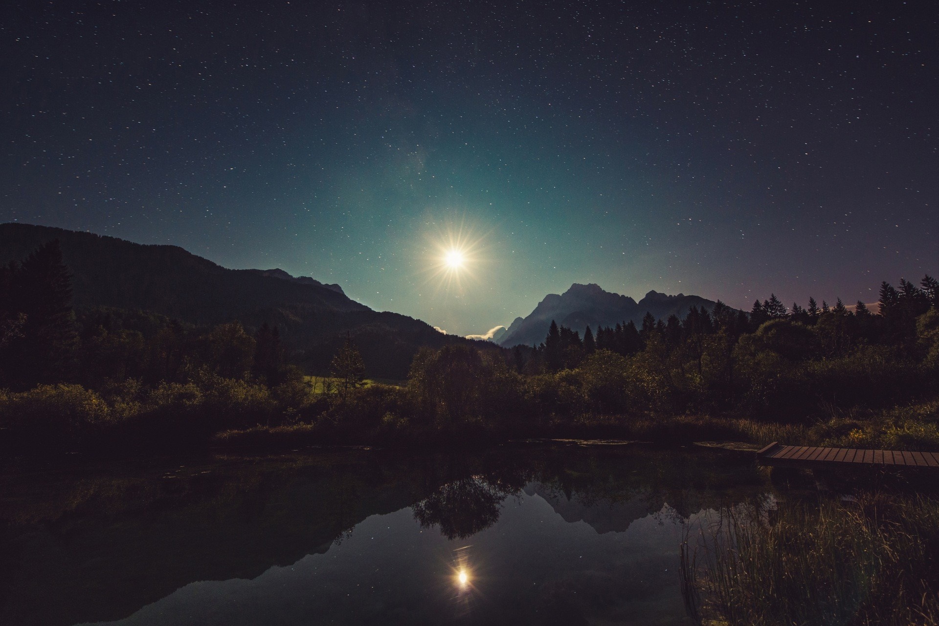 Moonlit night sky over mountains and lake HD Wallpaper