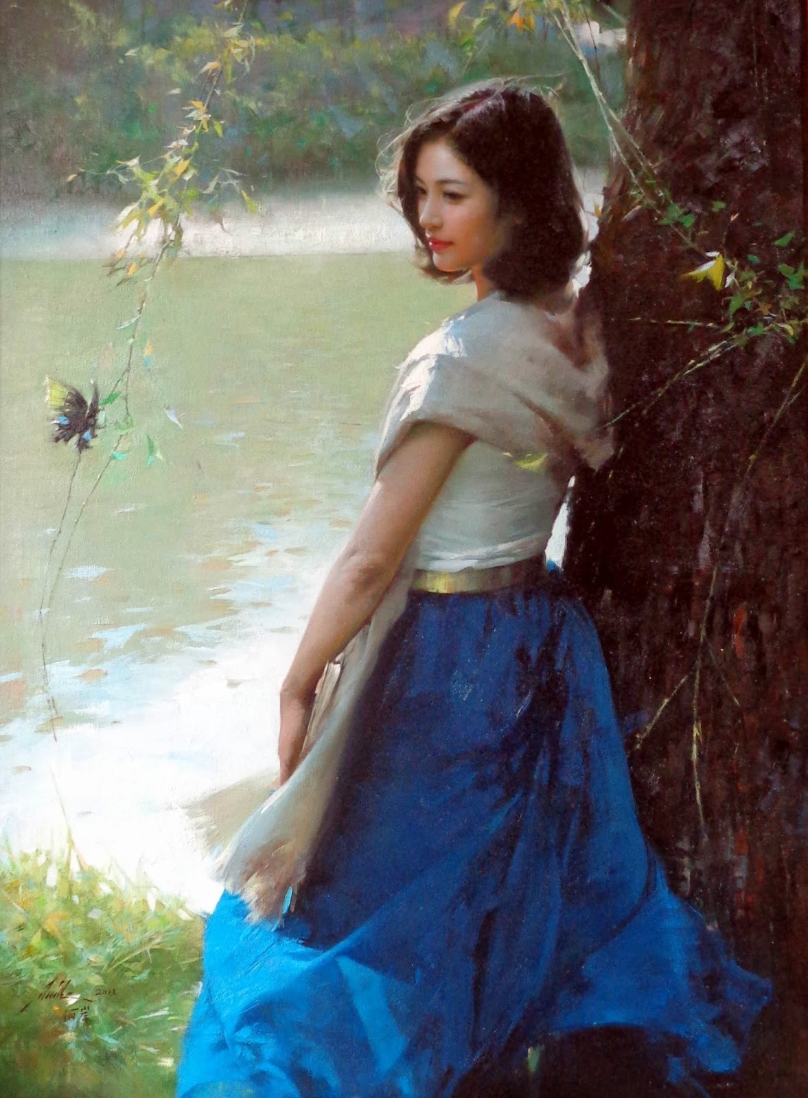 A woman in a blue dress by a tree and water HD Wallpaper