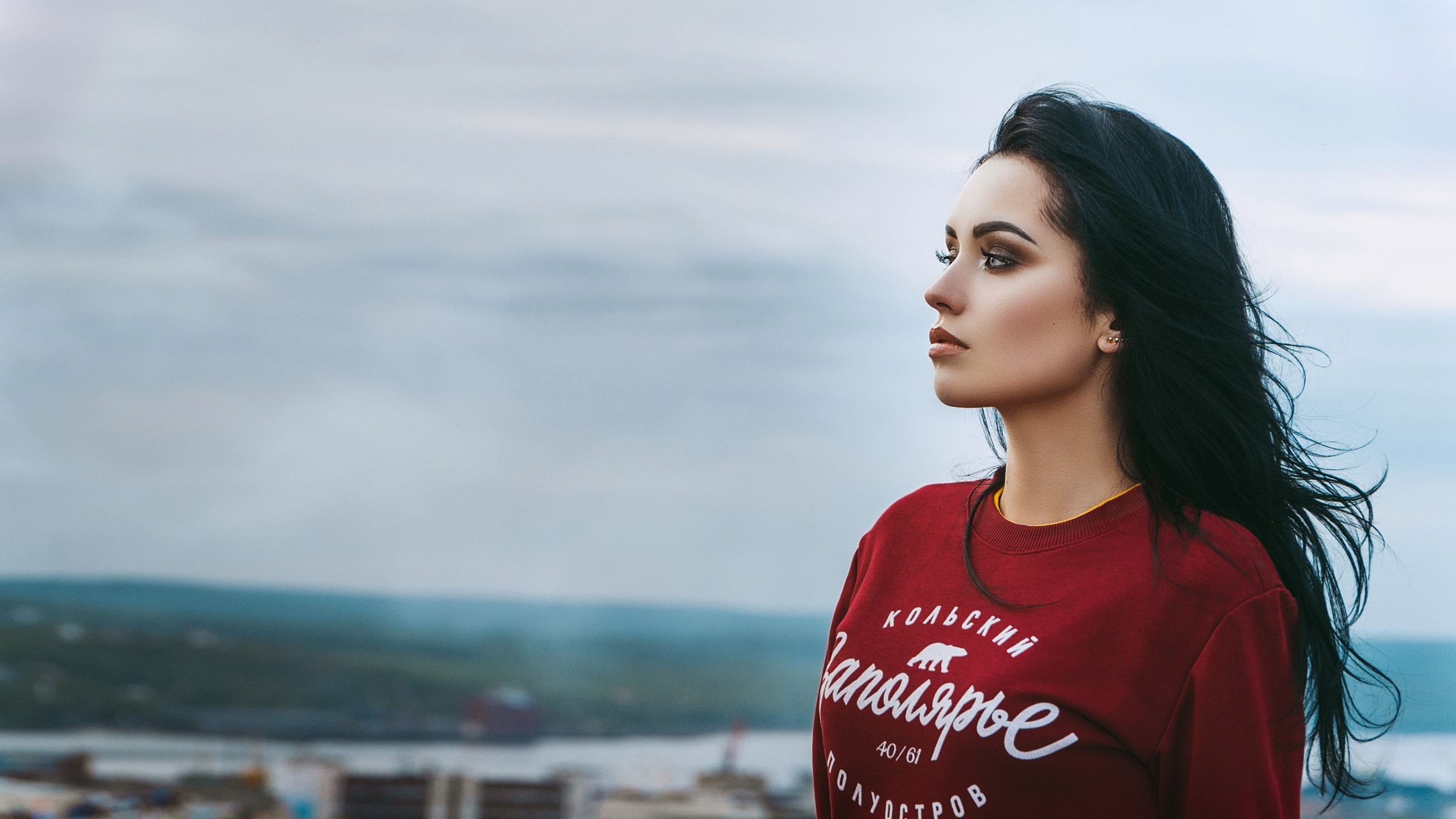 Woman with black hair looking away, red sweatshirt HD Wallpaper