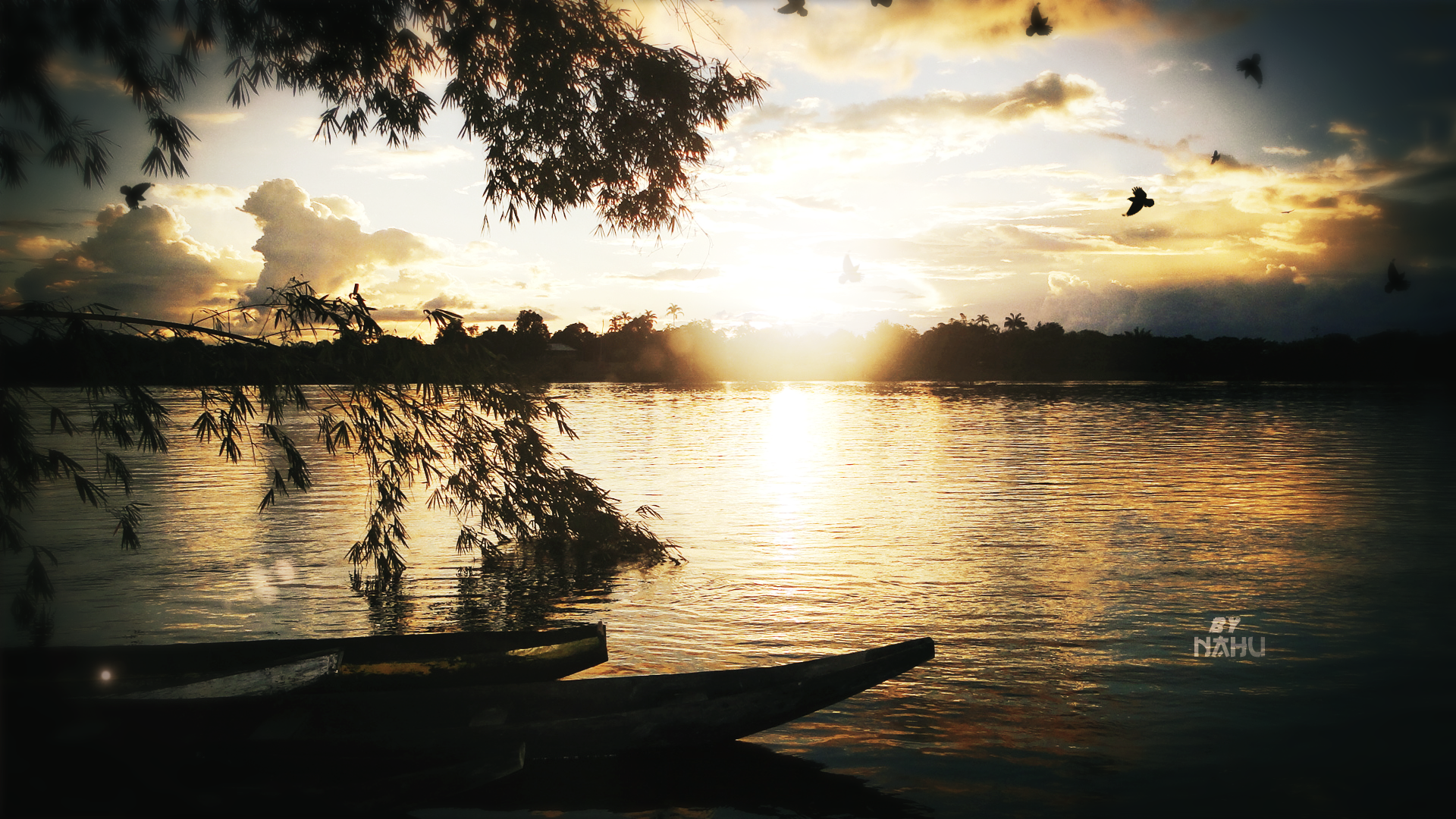 Sunset over a lake with boats and birds HD Wallpaper