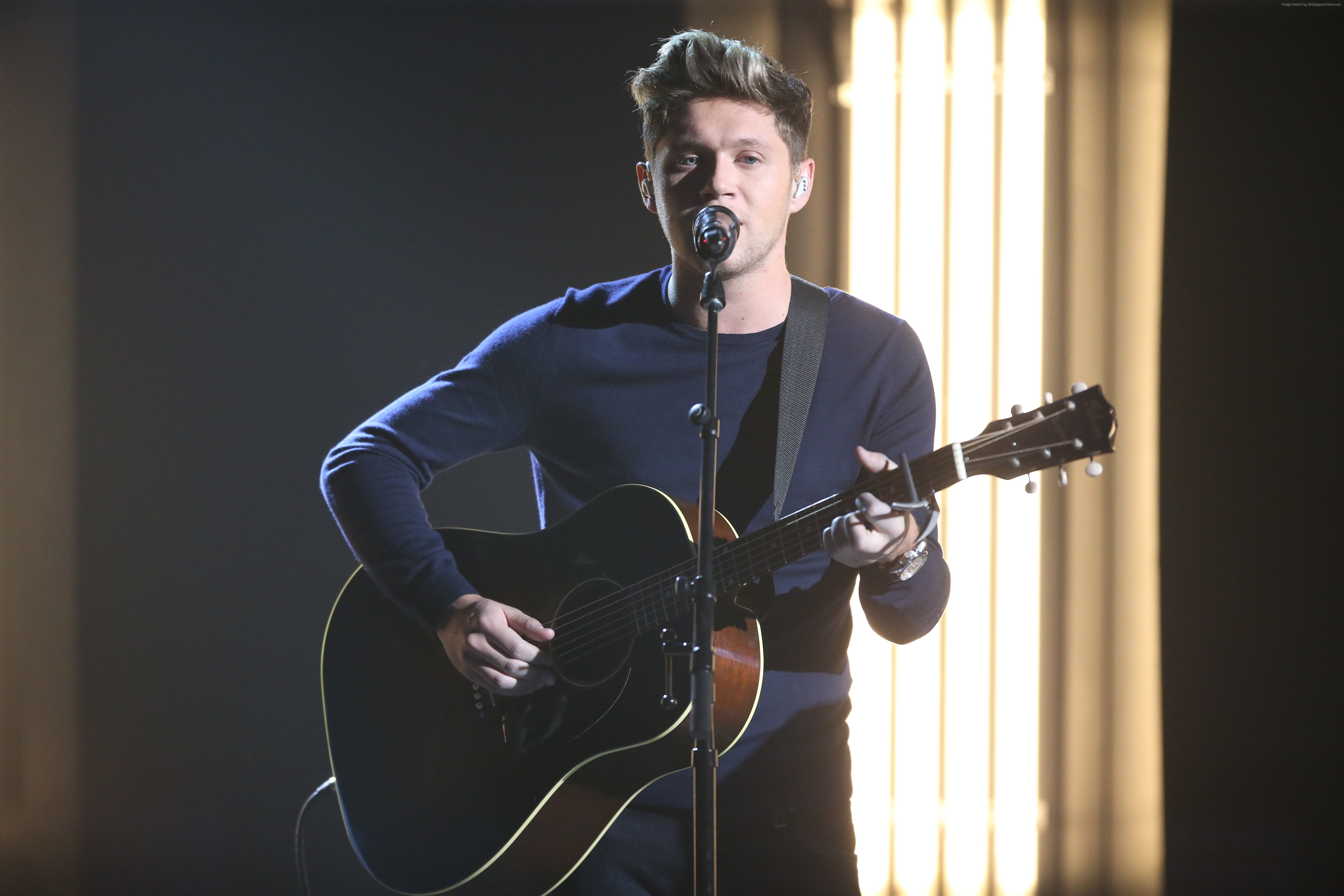 Niall Horan performing with guitar HD Wallpaper