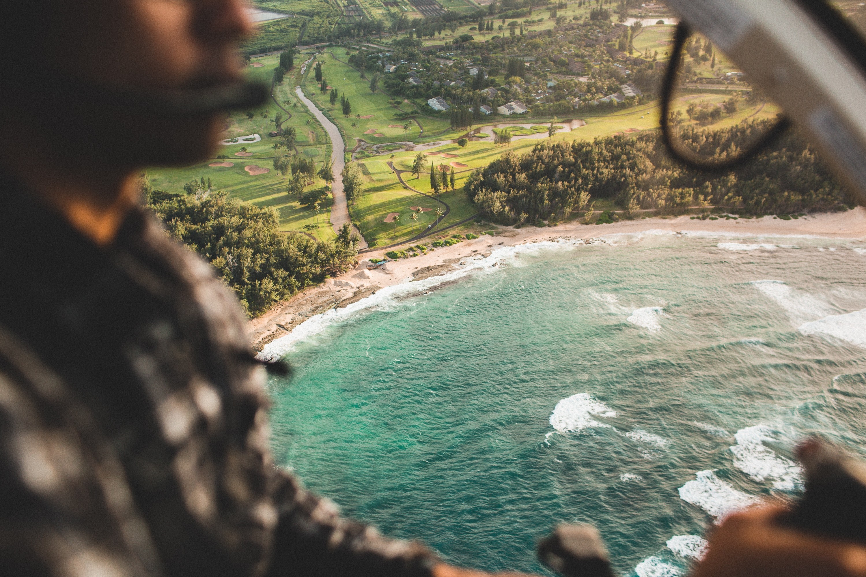 Aerial view of coastline with golf course and person HD Wallpaper