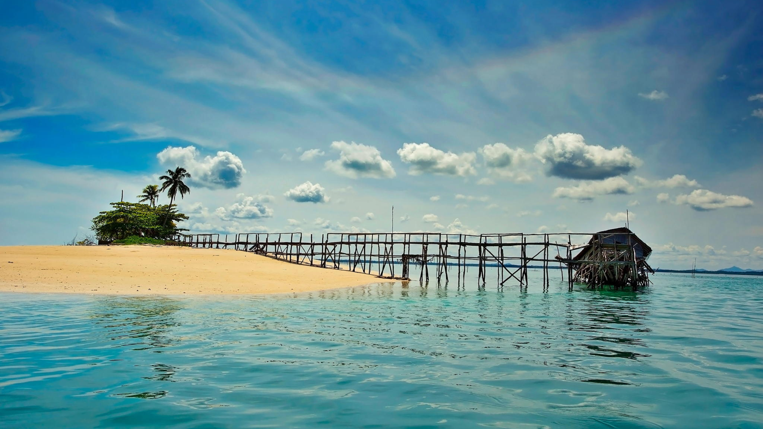 Wooden pier and hut on a tropical island with palm trees HD Wallpaper
