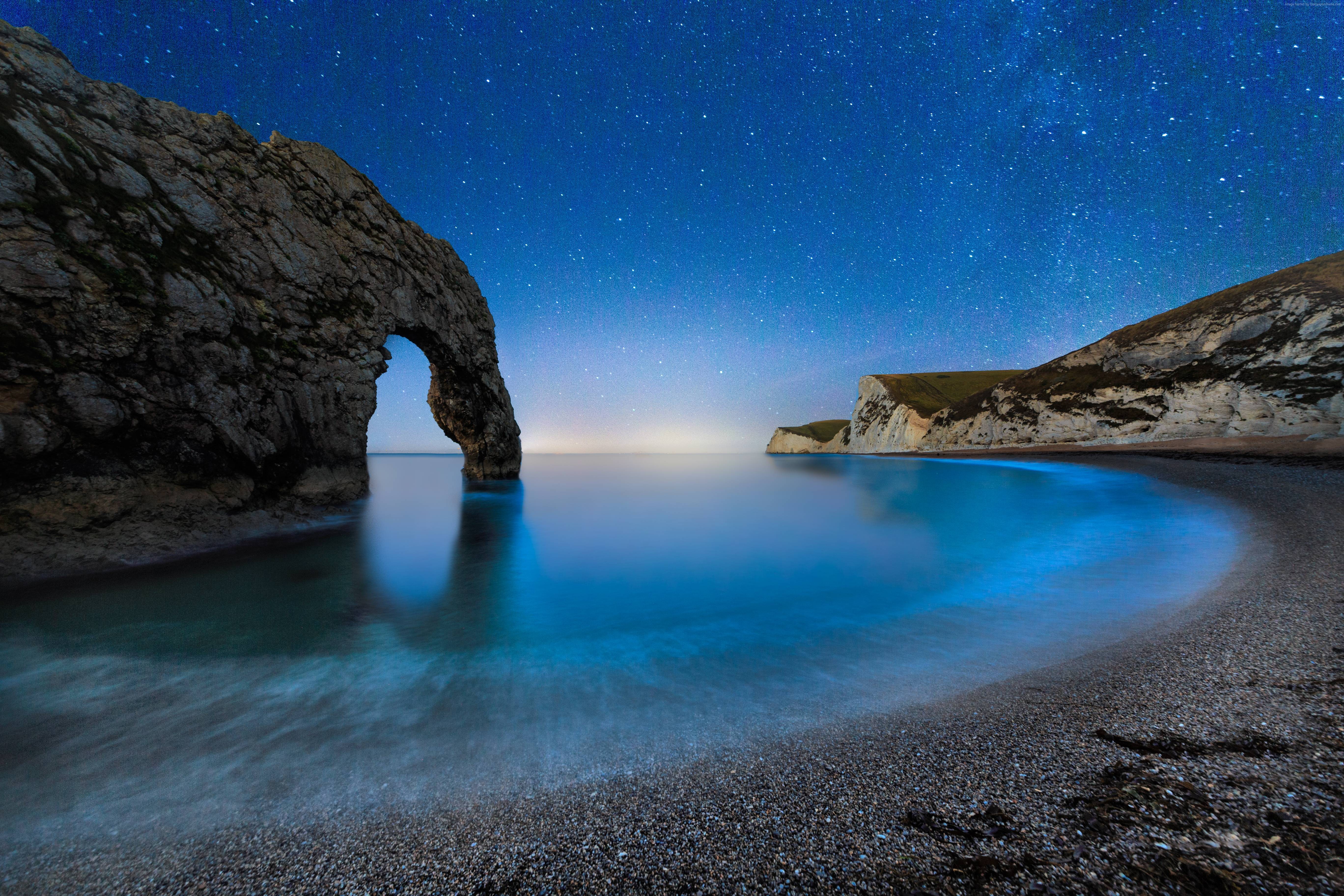 Durdle Door at Night with Stars and Bioluminescence HD Wallpaper