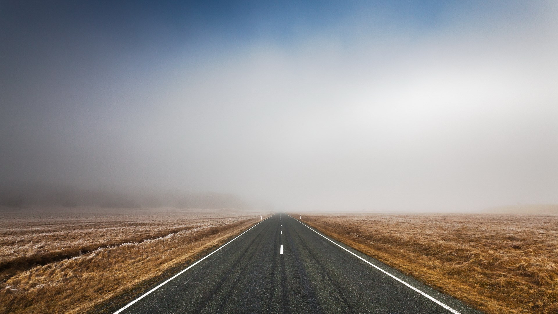 Empty road disappearing into fog HD Wallpaper