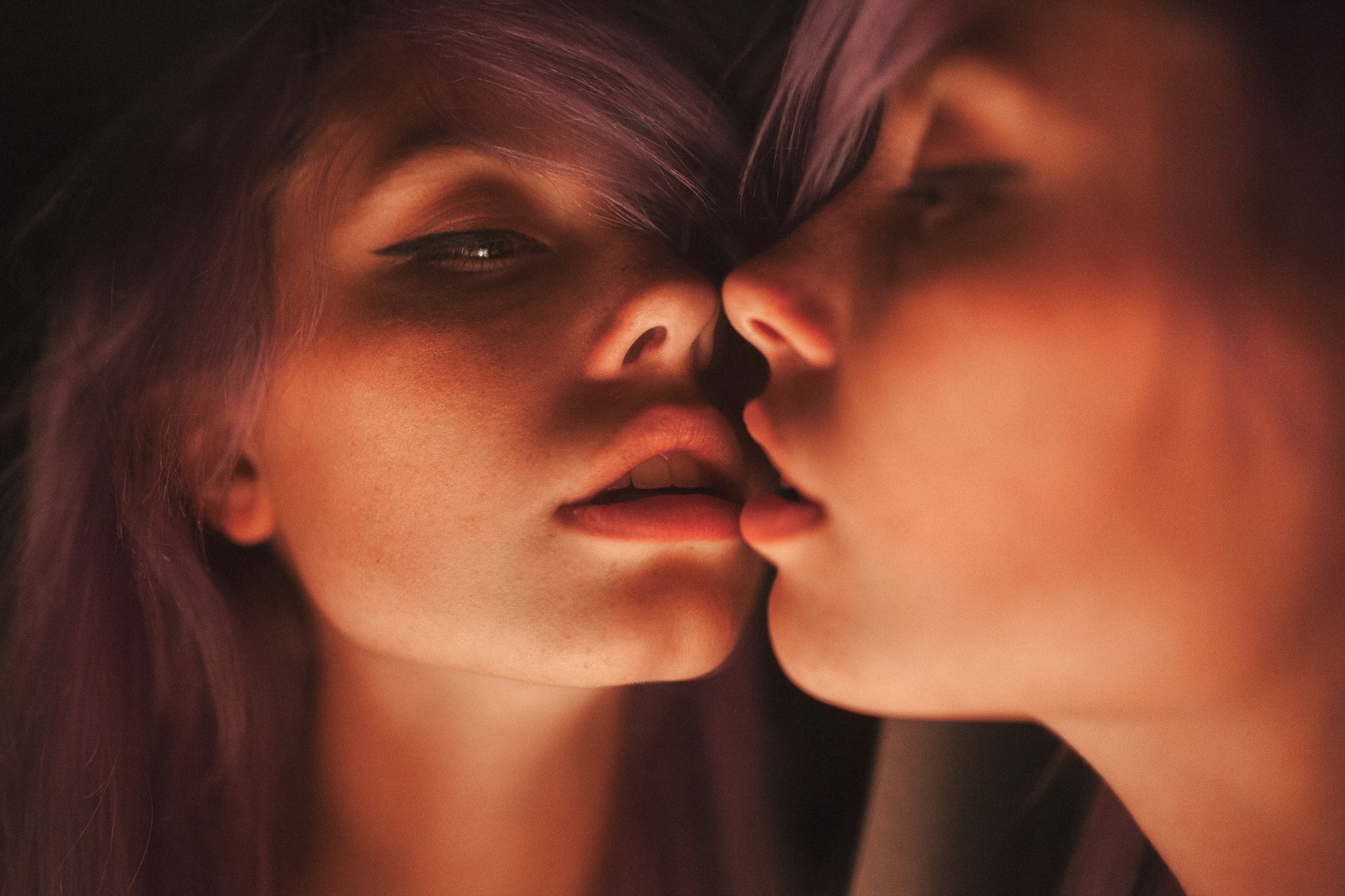 Woman with purple hair looking in a mirror HD Wallpaper