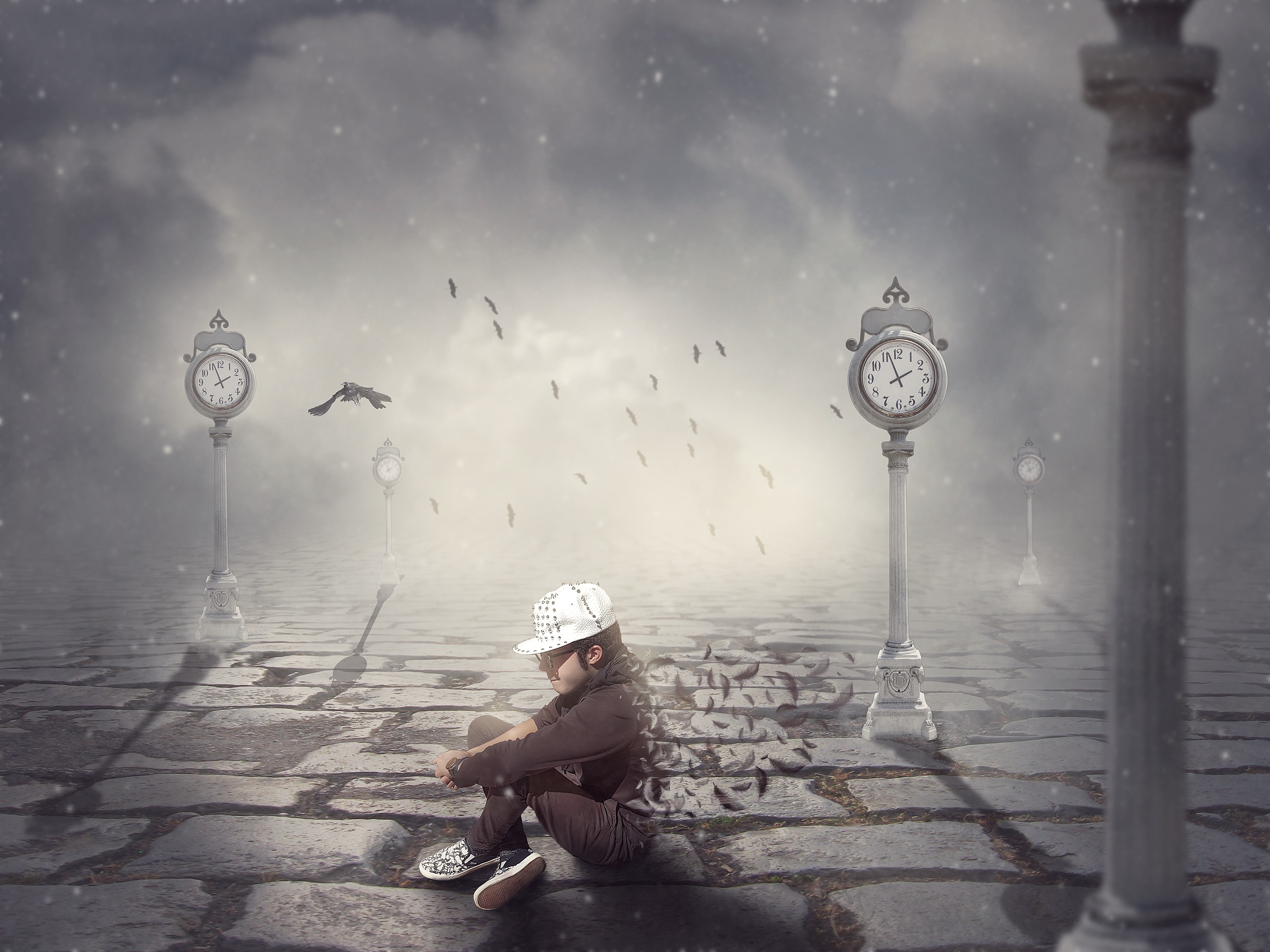 A child sits on a cobblestone path with clocks and birds in the mist HD Wallpaper