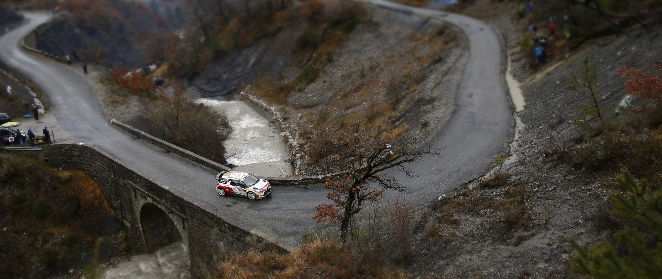 Citroen rally car on a bridge over a river HD Wallpaper