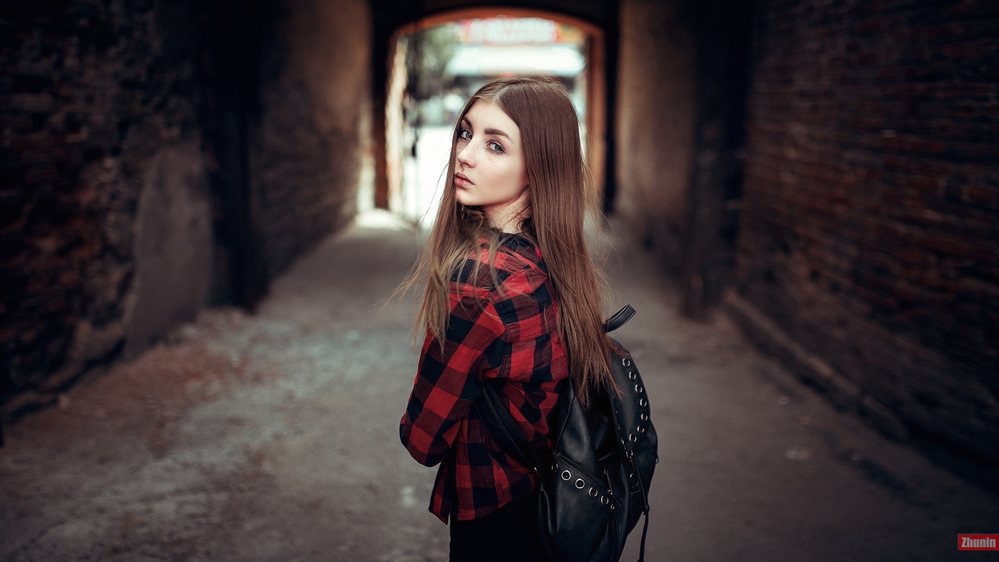 Woman in red and black plaid shirt with backpack HD Wallpaper