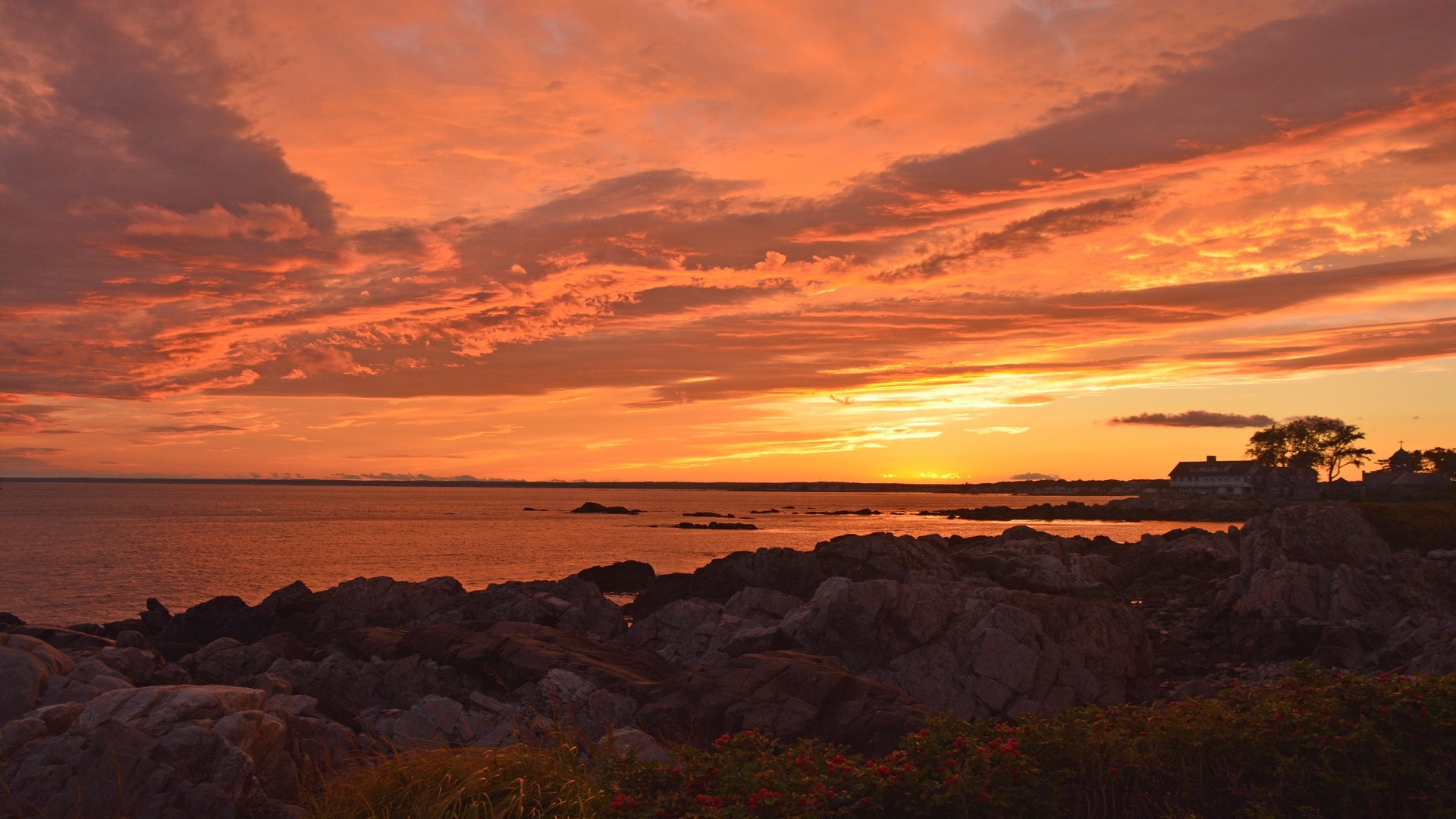 Sunset over the ocean with rocky coast HD Wallpaper