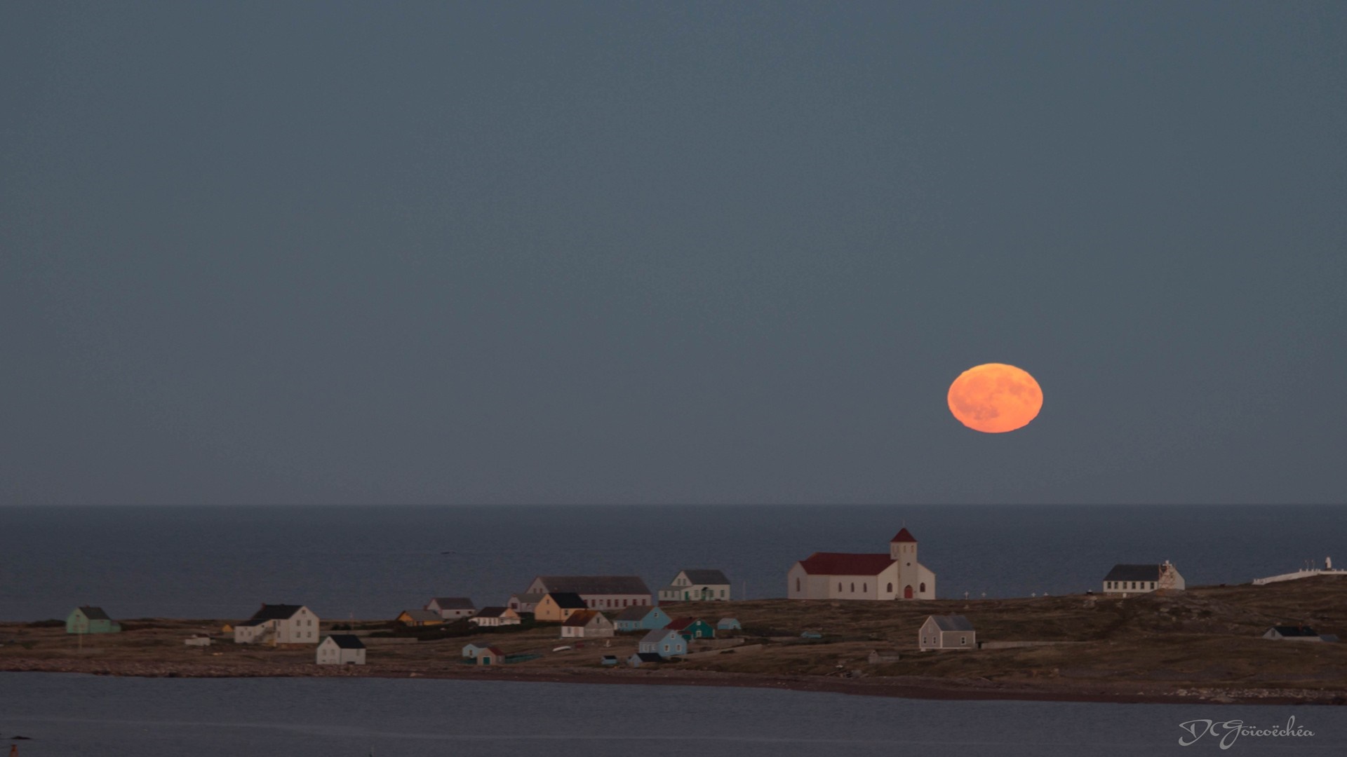Full moon over coastal village at dusk HD Wallpaper