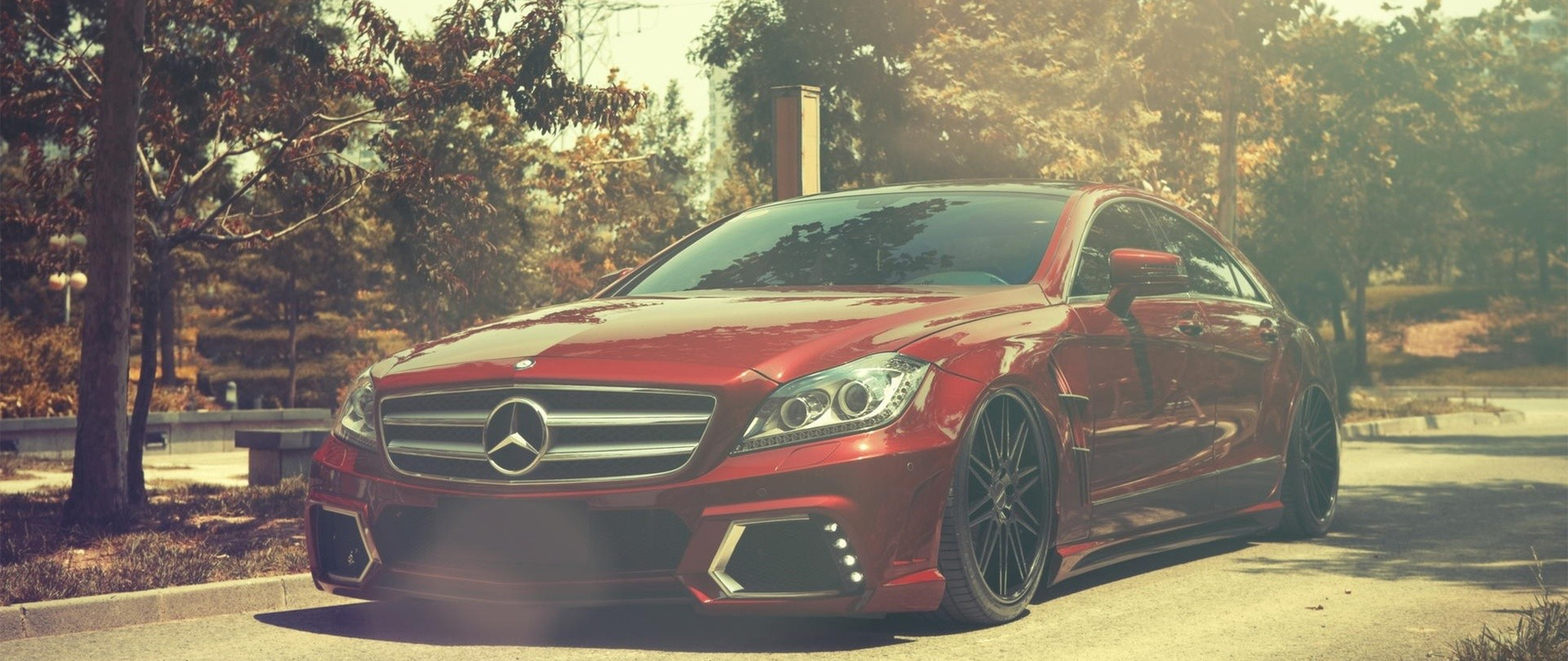 Red Mercedes-Benz E-Class Sedan with custom rims HD Wallpaper