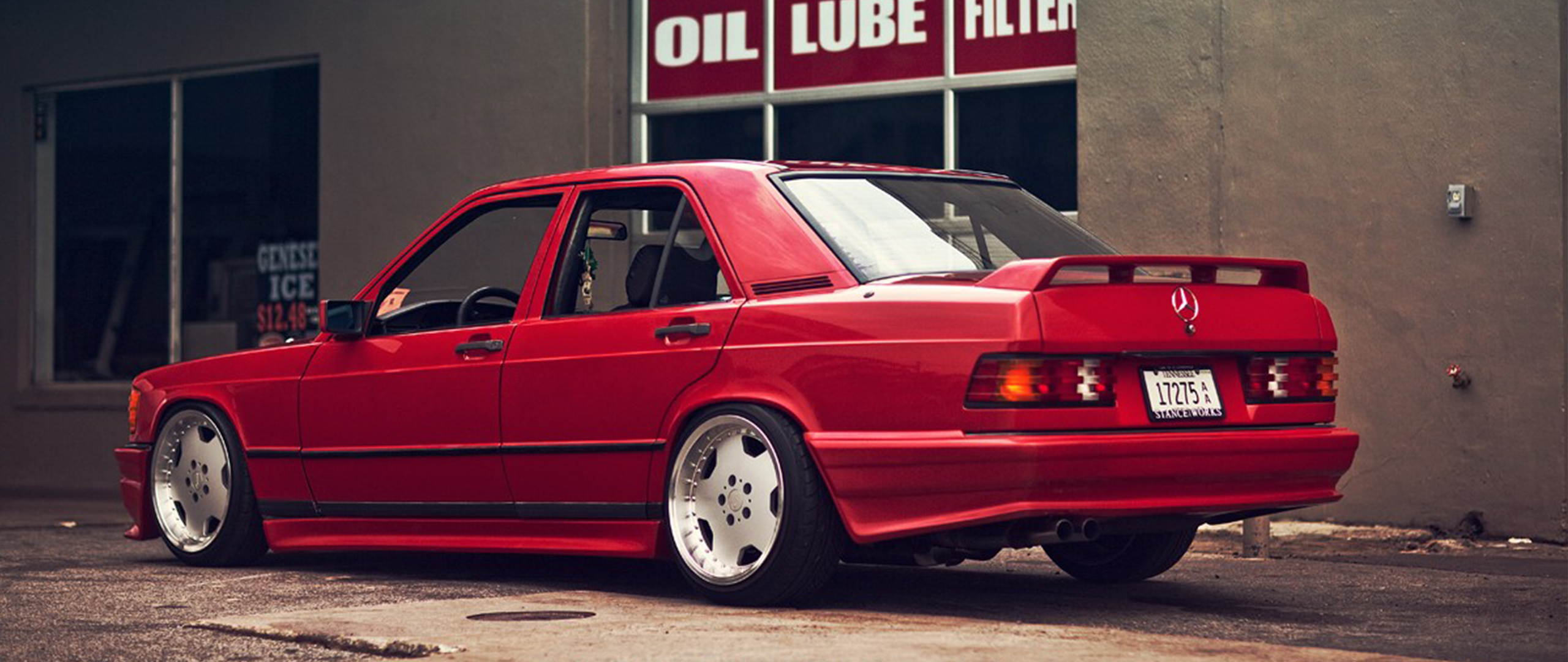 Red Mercedes-Benz 190E W201 with custom wheels HD Wallpaper