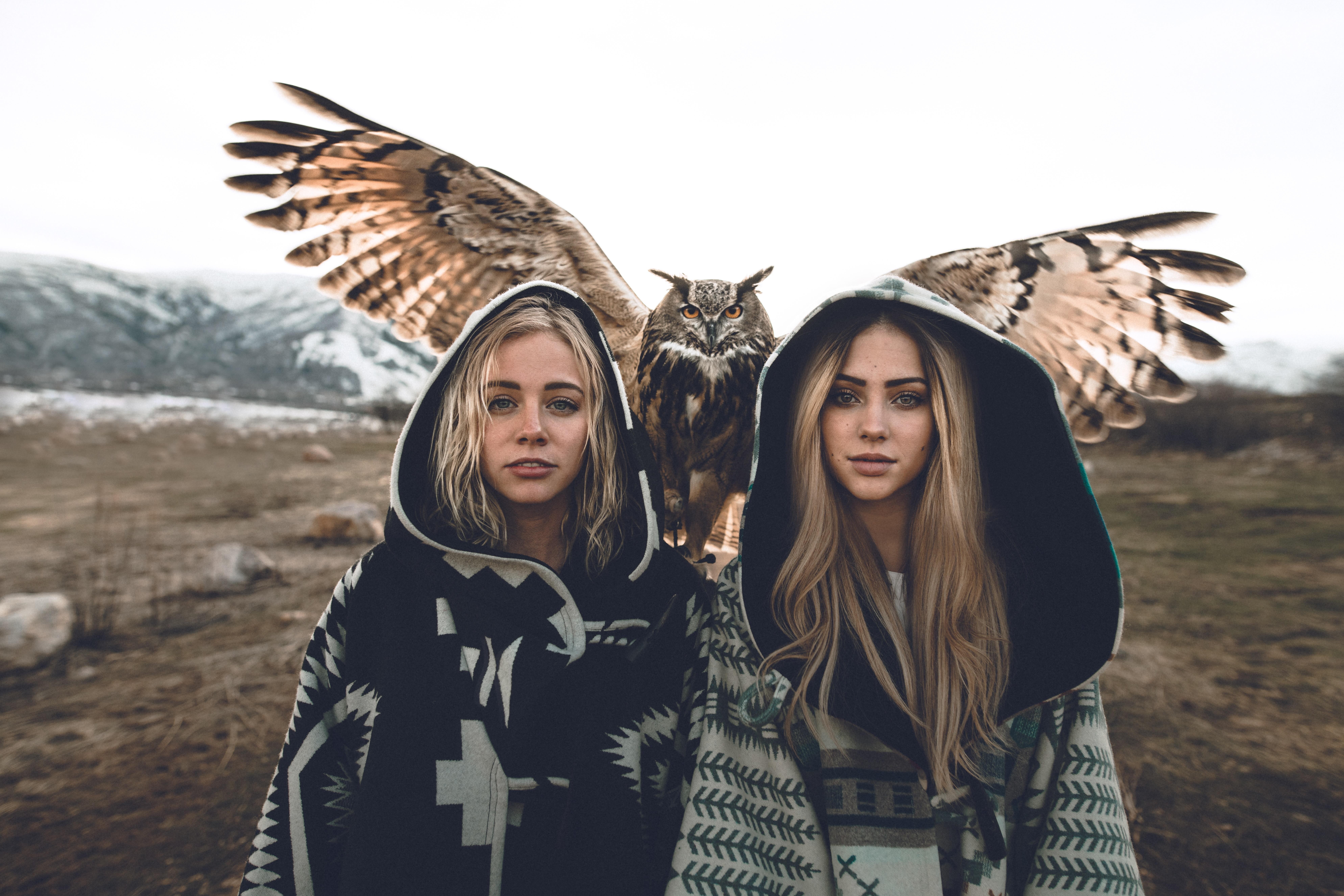 Two girls with an owl in a mountainous landscape HD Wallpaper