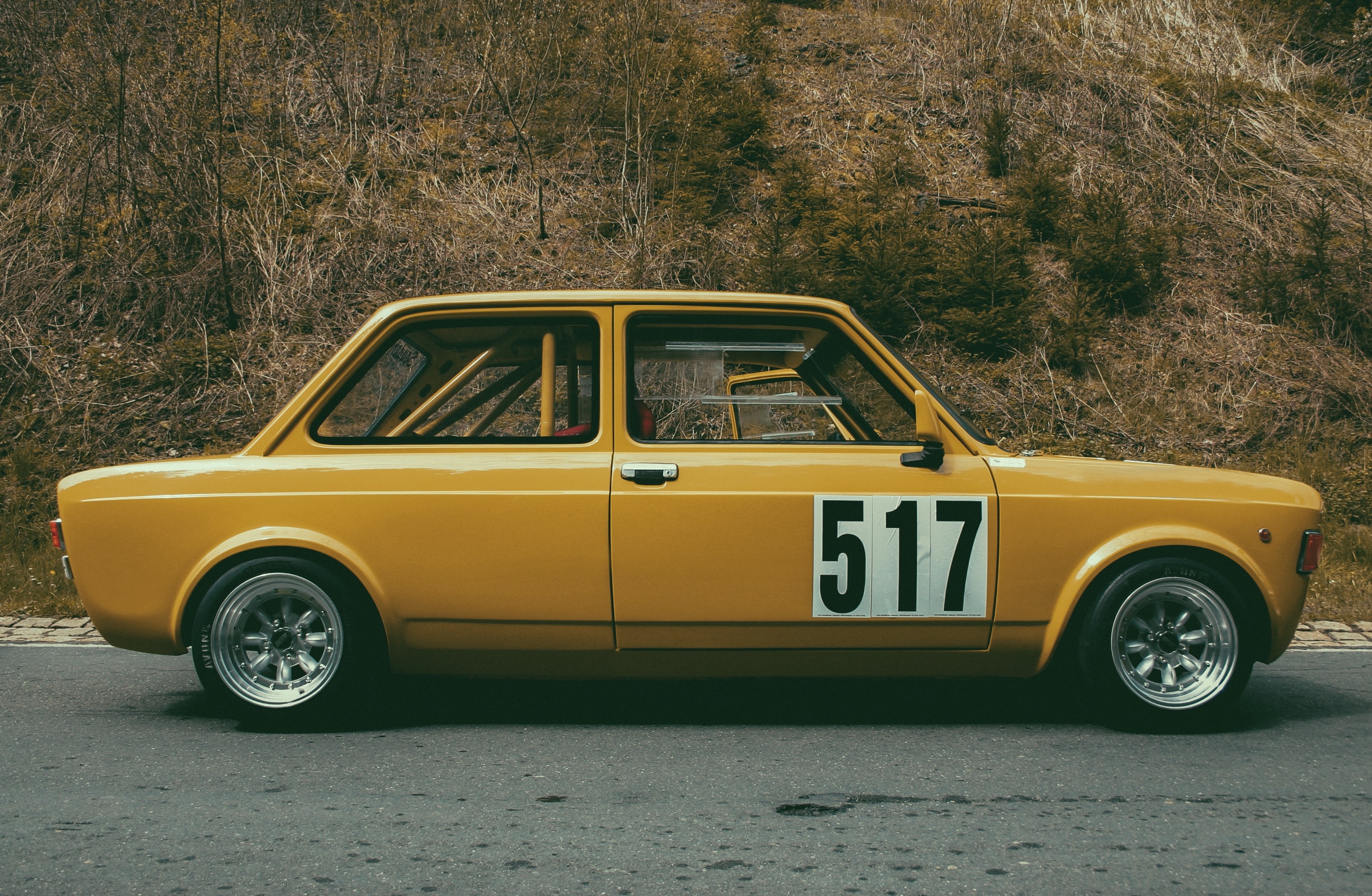 Yellow Fiat 128 race car with number 517 HD Wallpaper
