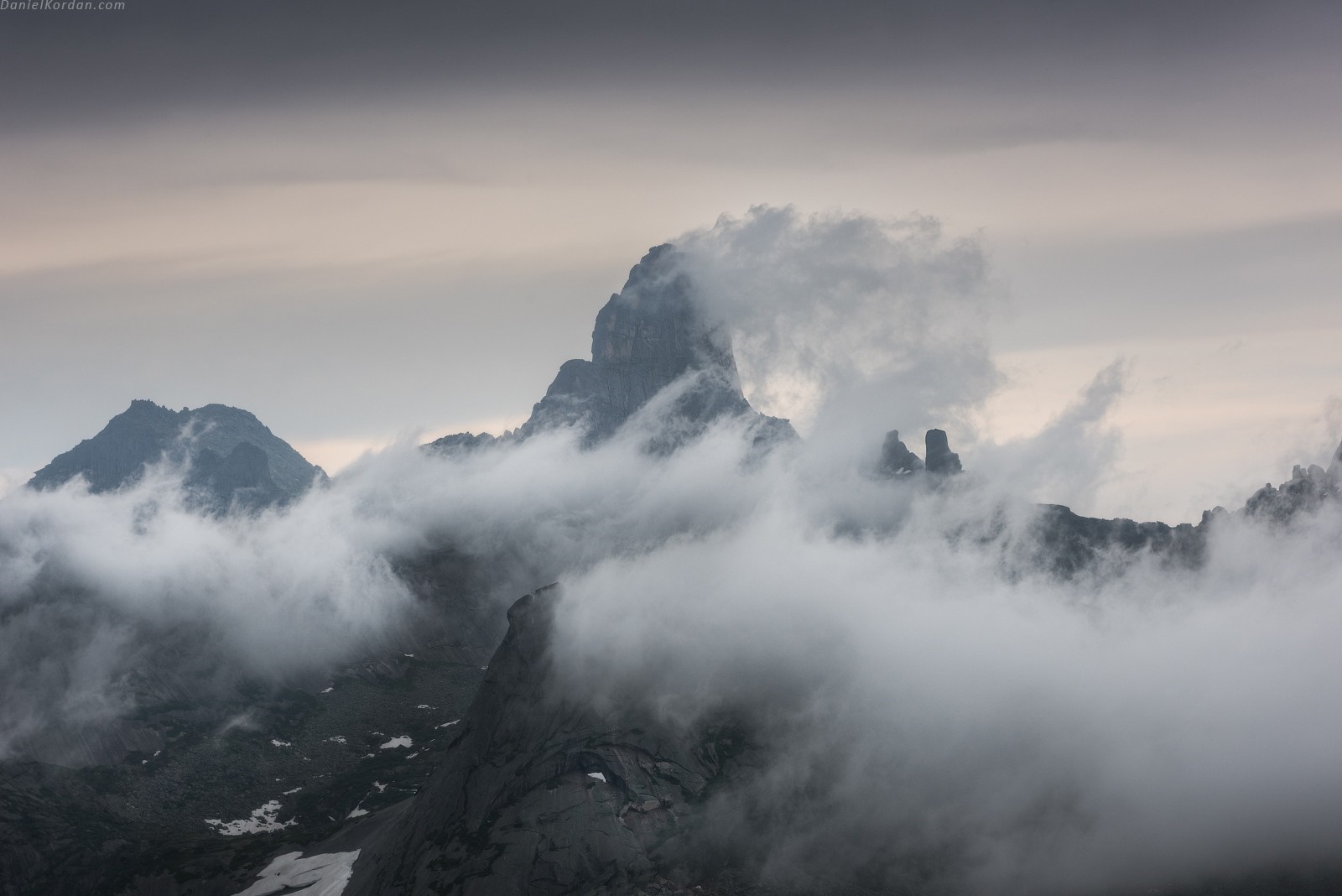 Misty mountain range with dramatic clouds HD Wallpaper