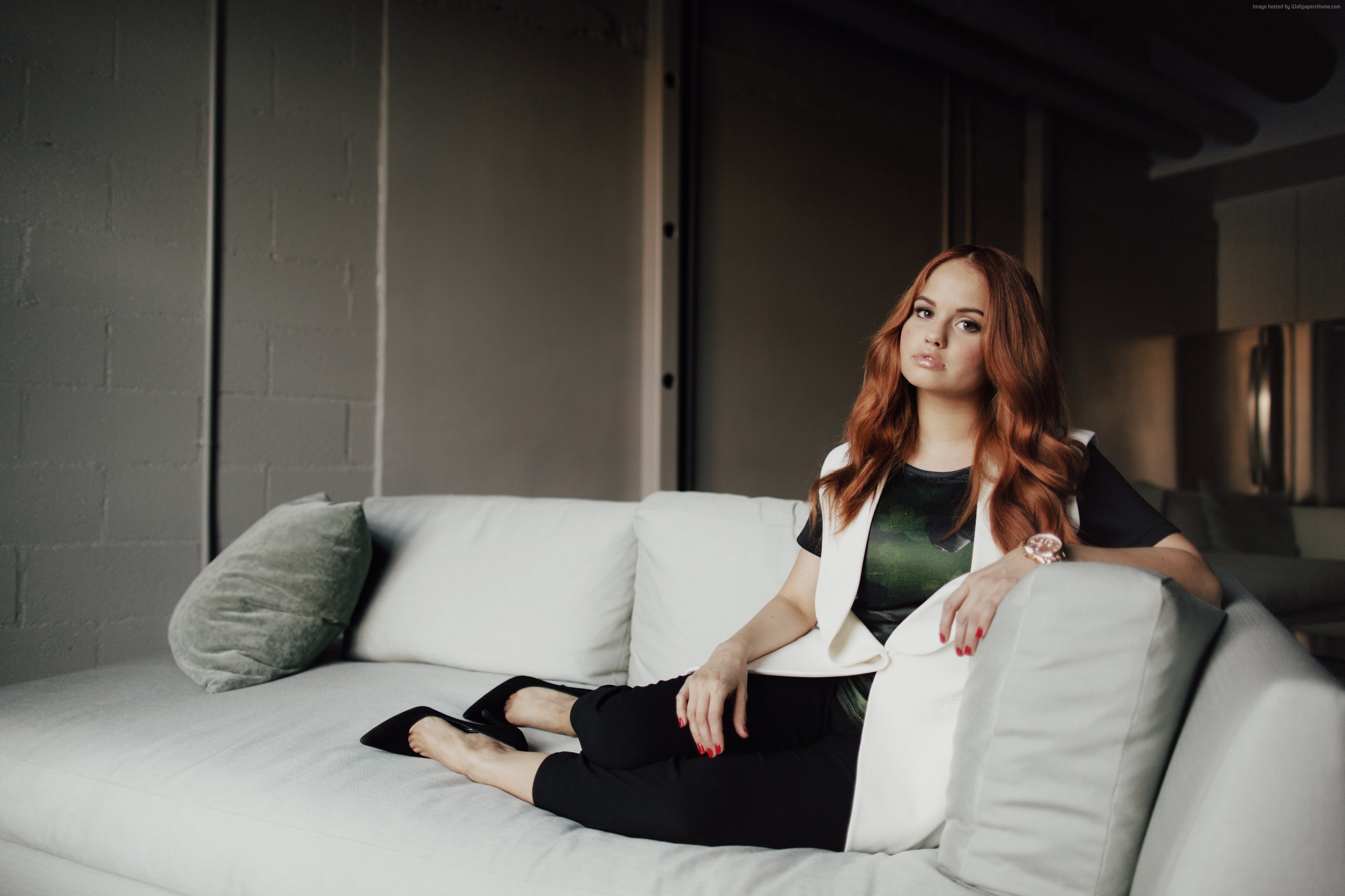 Debby Ryan on a couch HD Wallpaper