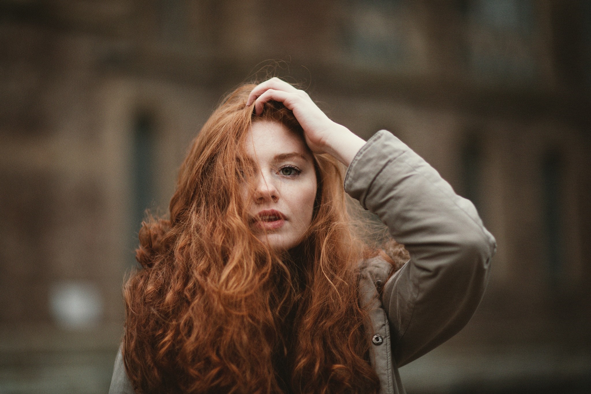 Redhead woman with long wavy hair in a jacket HD Wallpaper