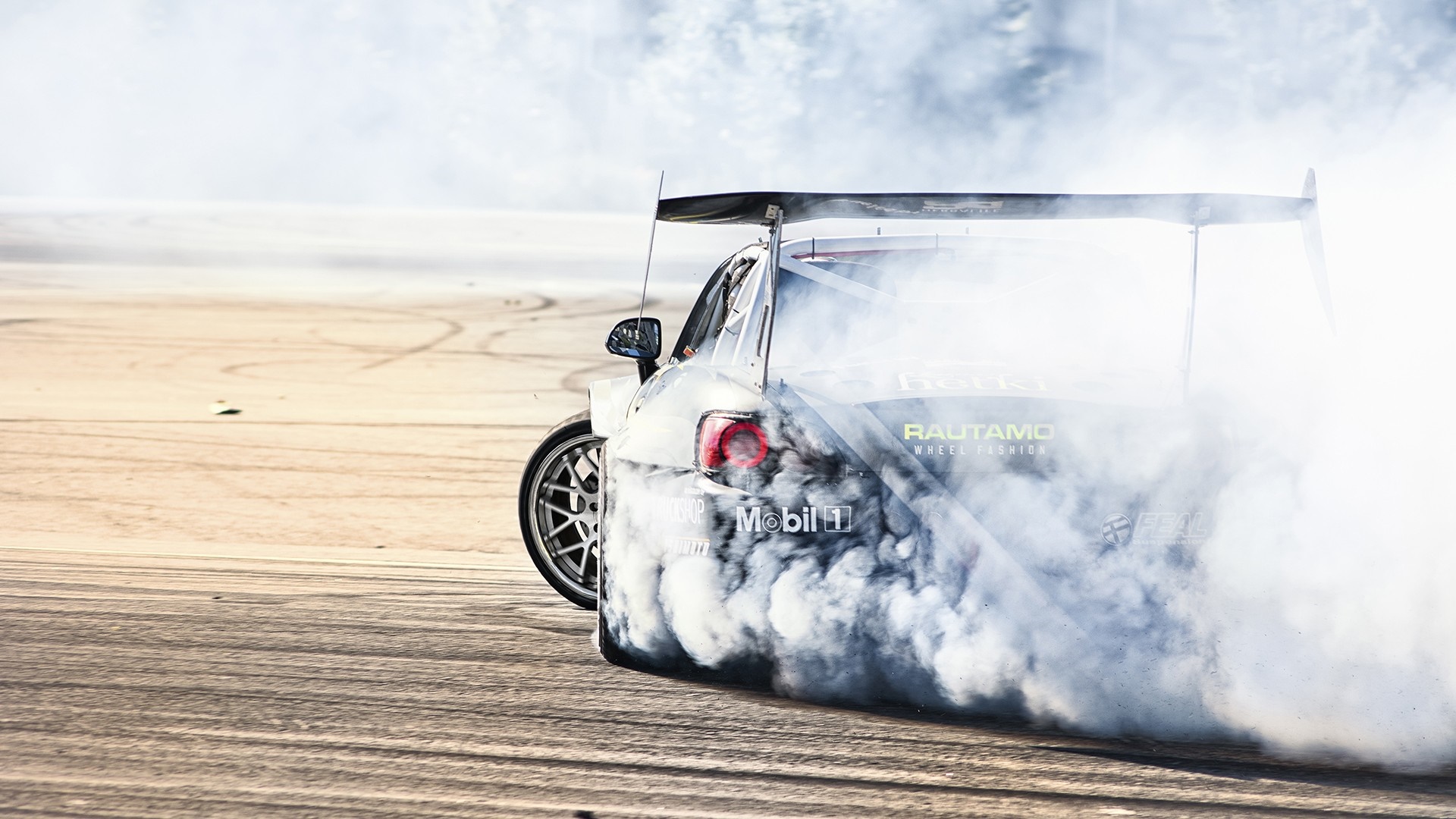 Drifting race car with Mobil 1 sponsorship HD Wallpaper